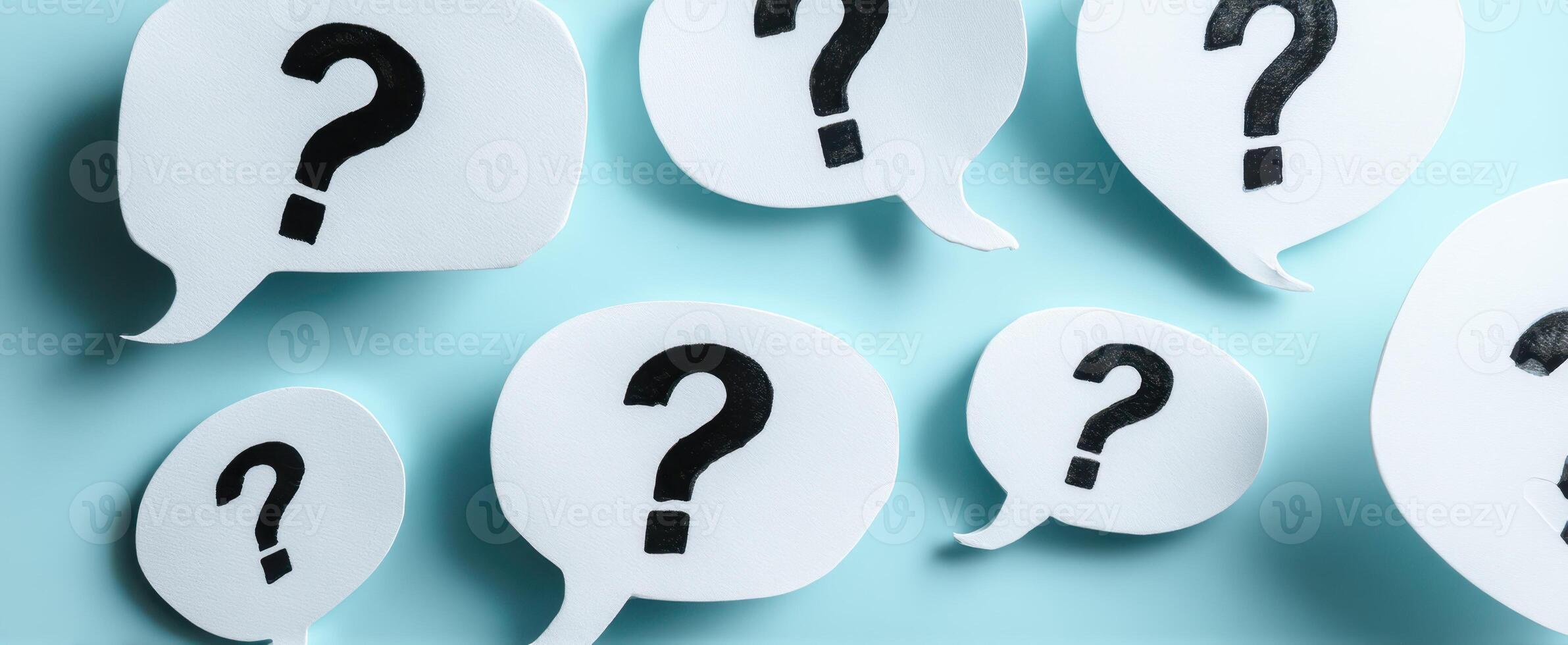The collection of question marks in speech bubbles on a blue background. photo