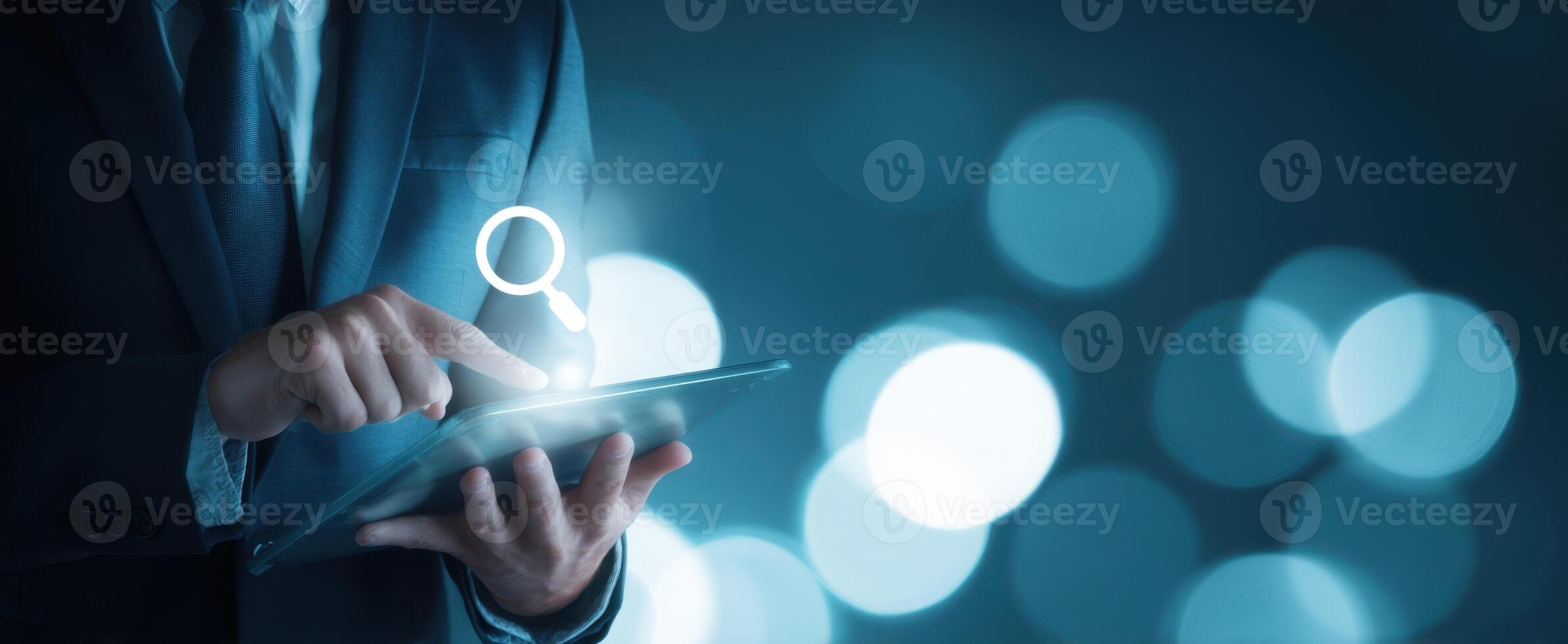 The professional using a tablet to search in a modern digital environment. photo