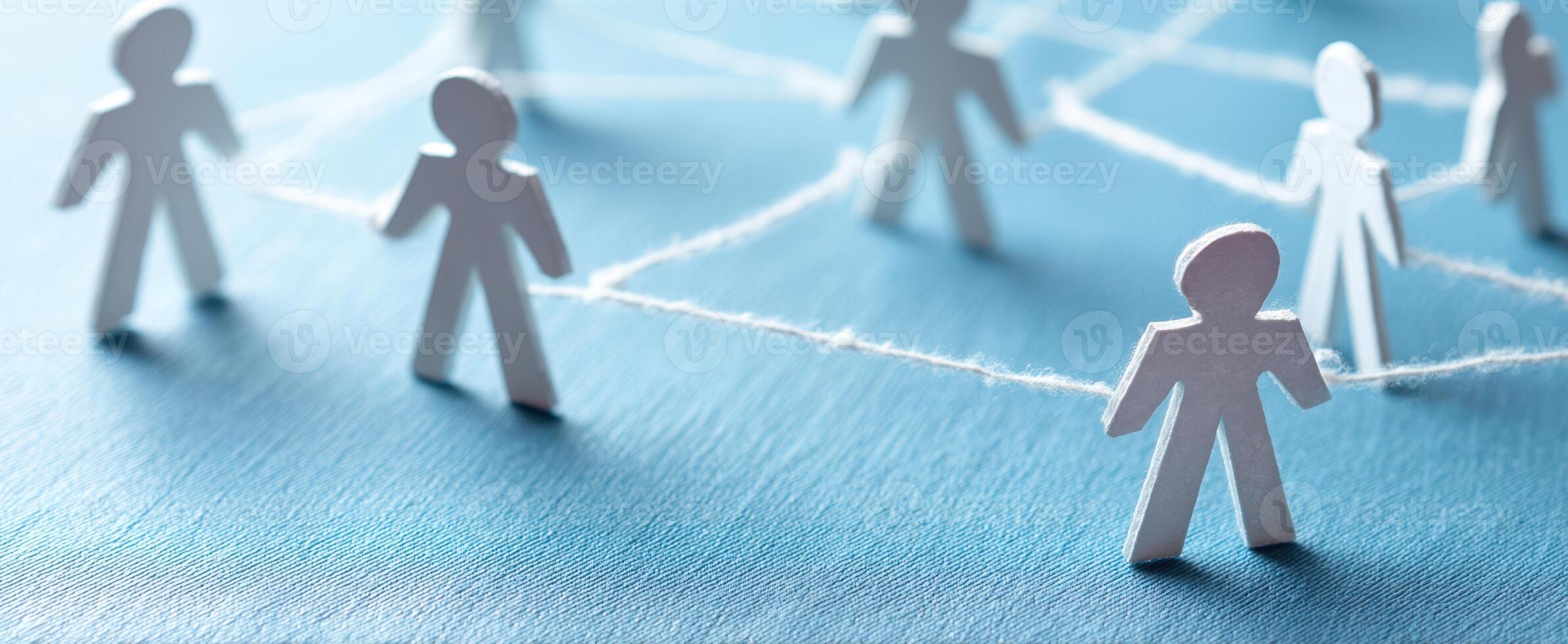 The interconnected figures representing community and collaboration in a digital environment. photo