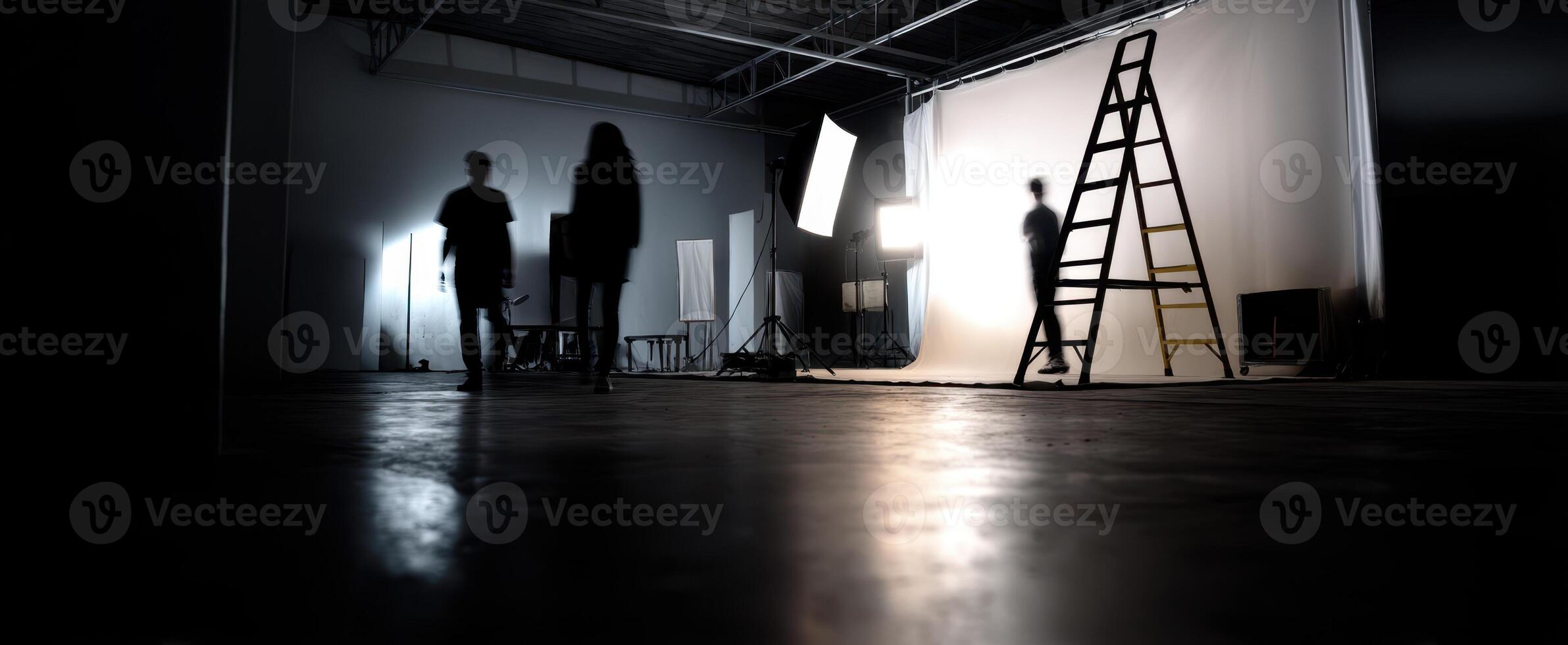 The creative studio space with silhouettes and lighting equipment in use. photo