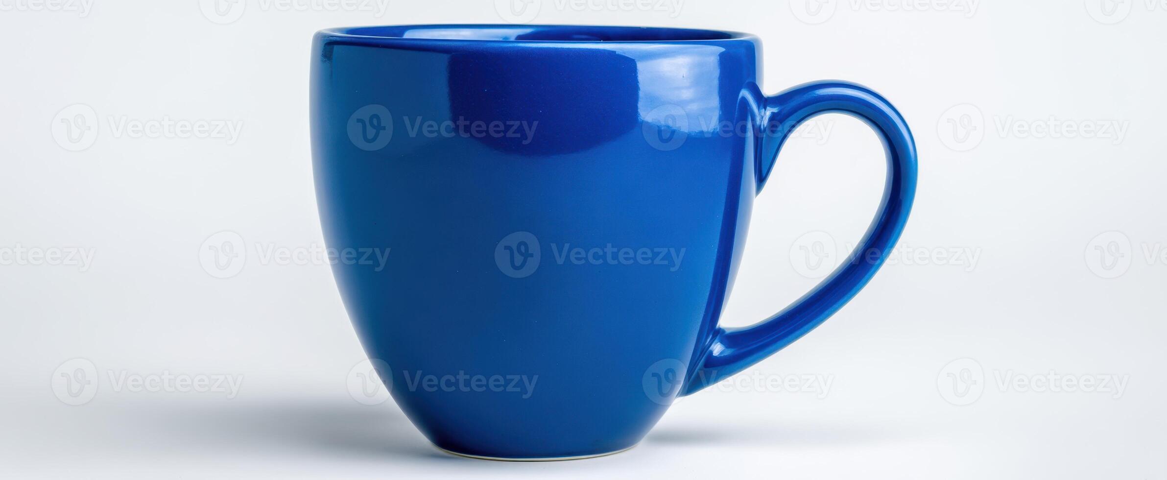 The vibrant blue ceramic mug on a clean background photo