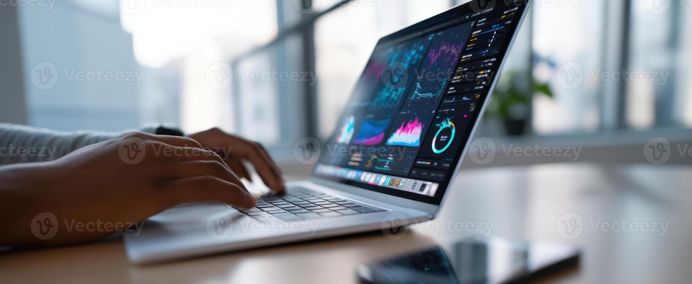 The laptop displaying data analysis in a modern workspace environment. photo