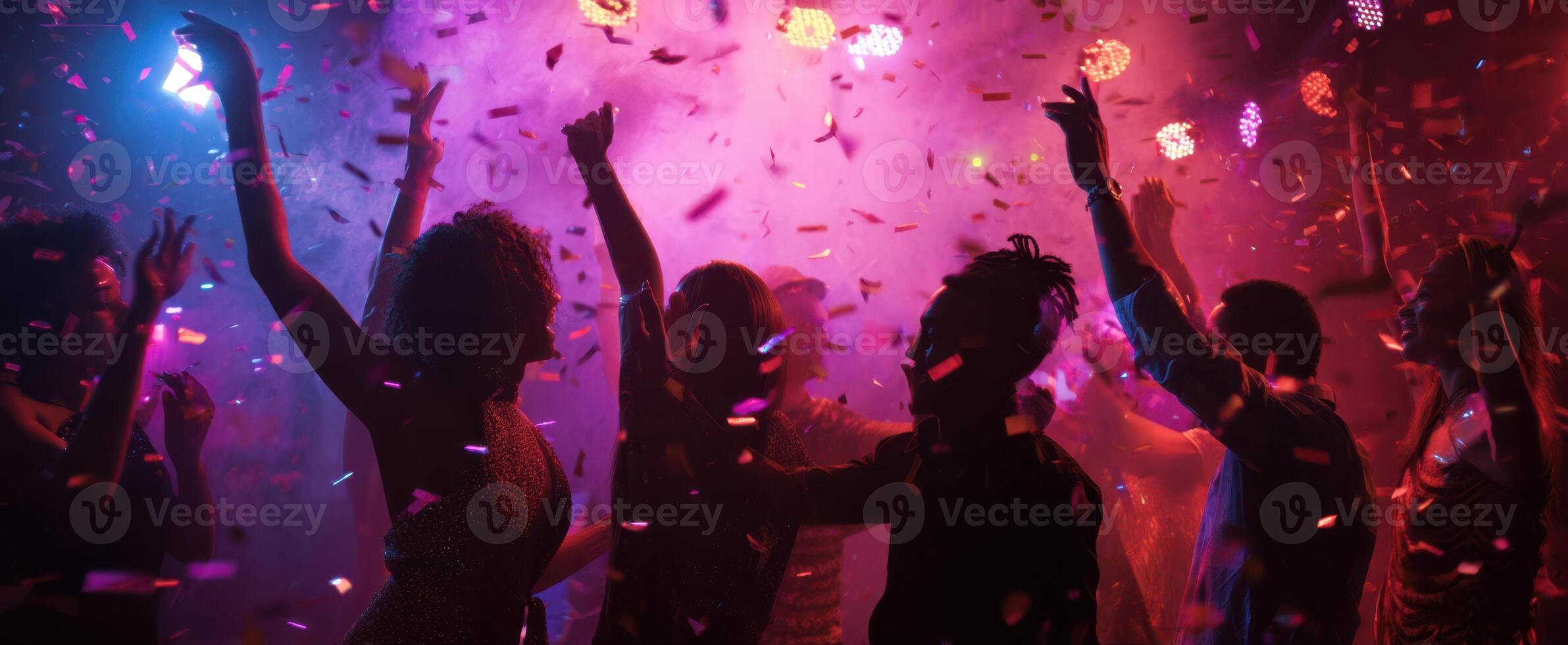 The vibrant atmosphere of a lively party filled with dancing and confetti. photo