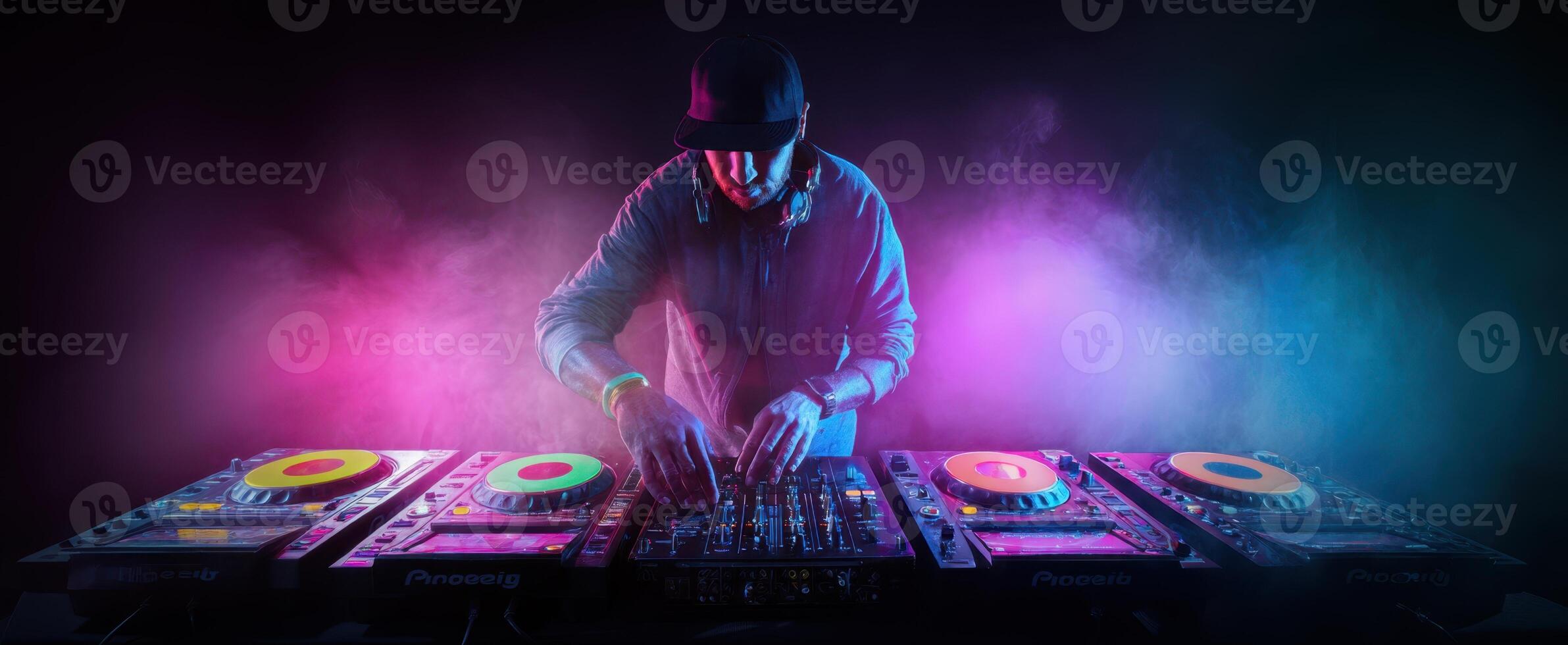 The DJ Creating Electric Beats in a Colorful Nightclub Atmosphere photo