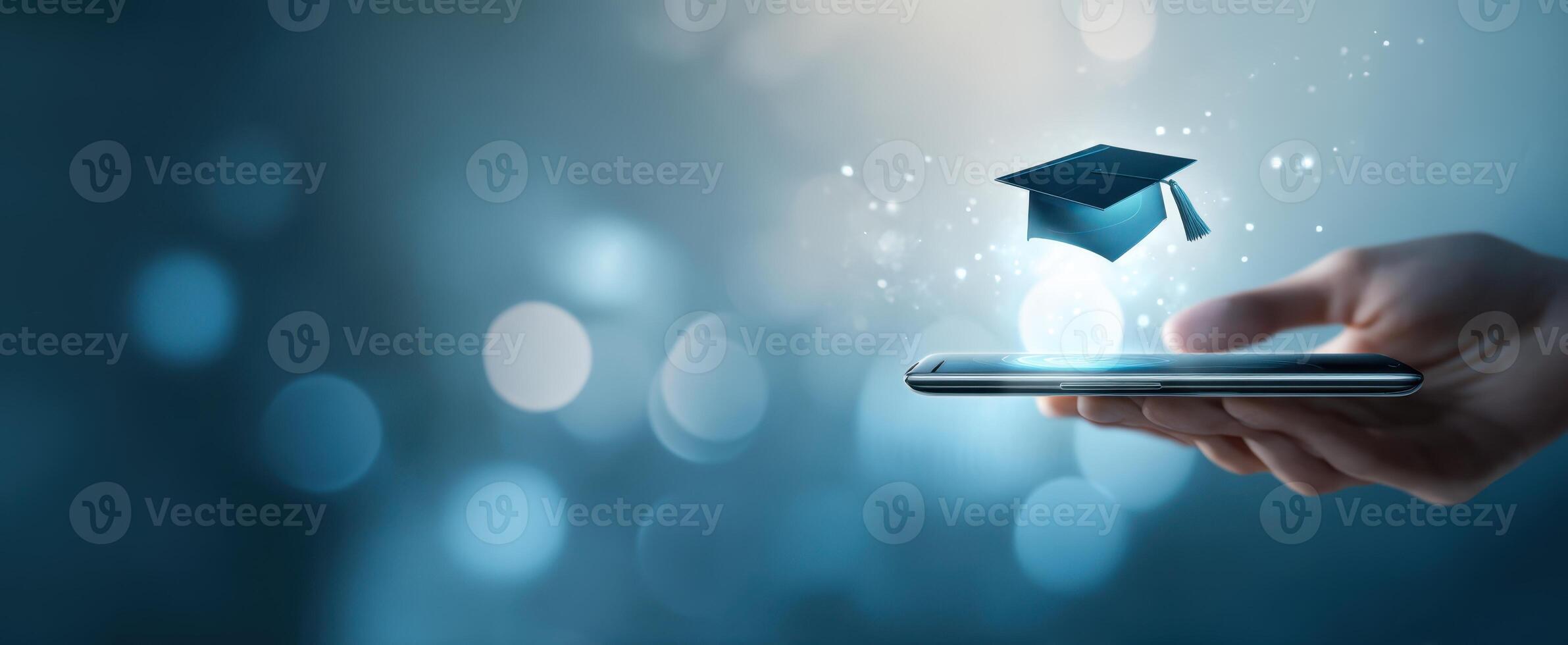 The smartphone displaying a floating graduation cap symbolizing digital education. photo