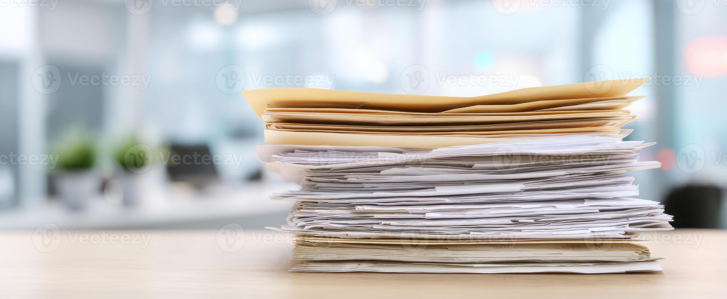 The stack of disorganized papers on an office desk in busy workspace. photo