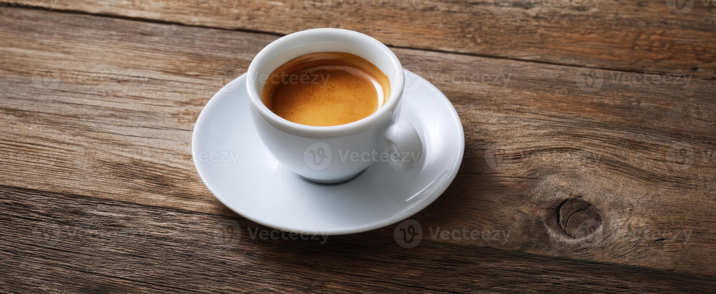 The elegant espresso cup on a rustic wooden table inviting warm moments. photo