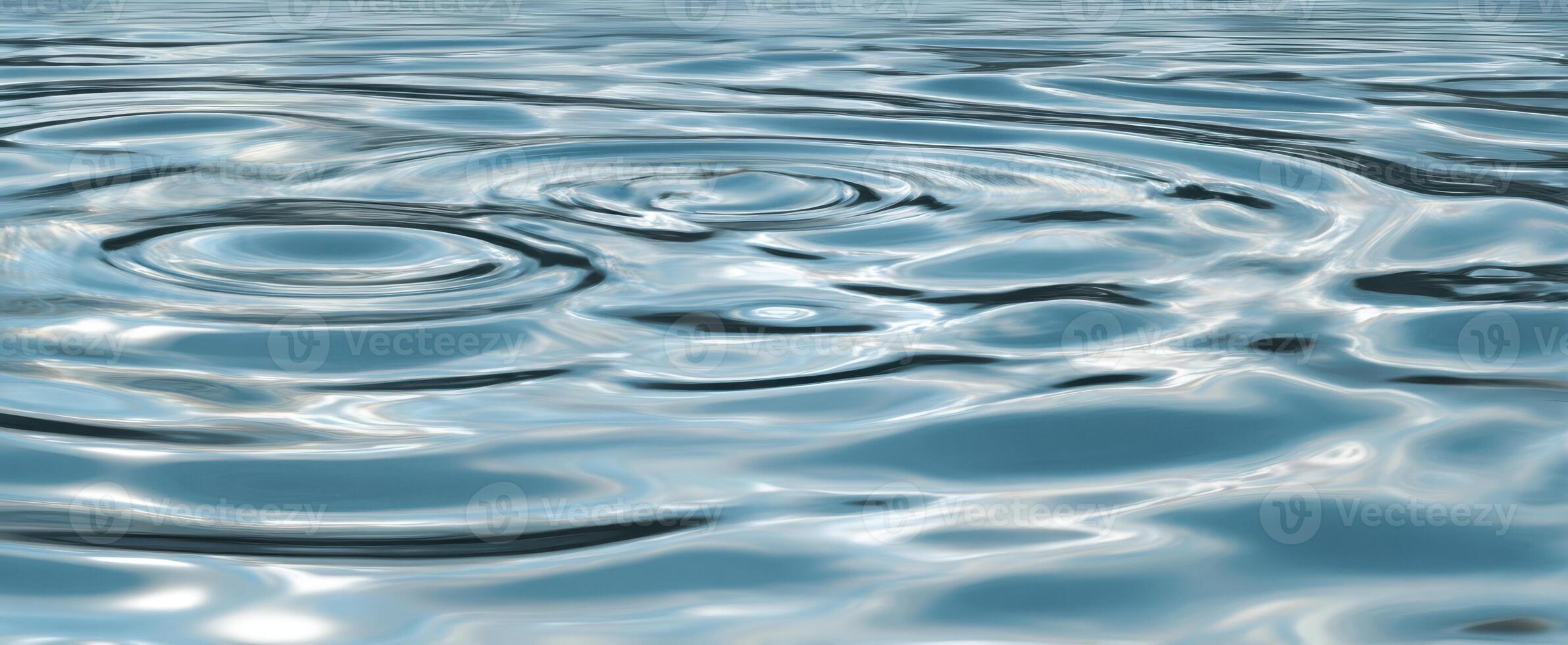 The serene beauty of water ripples reflecting sunlight on a calm surface. photo