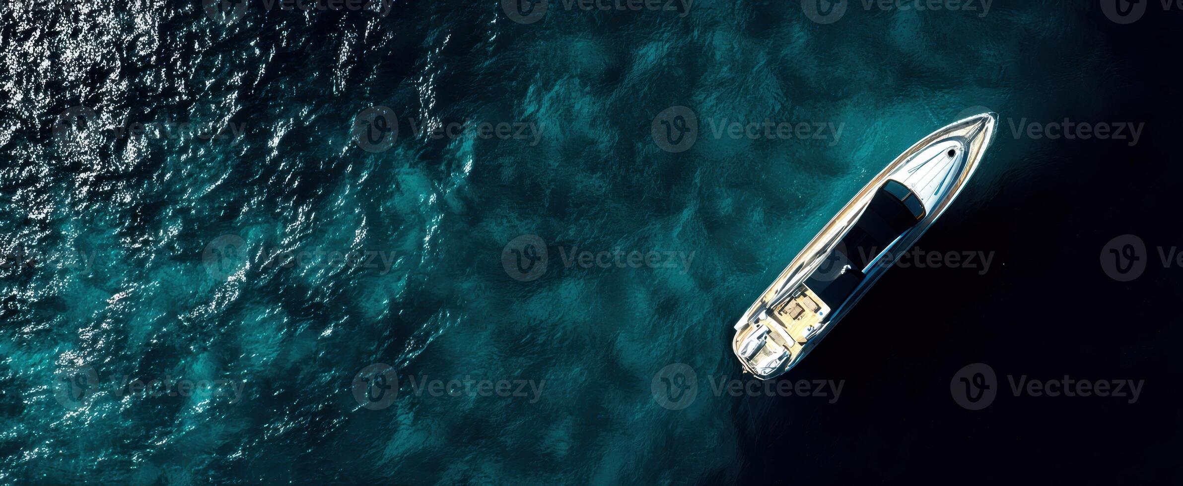 The aerial view of a luxury boat on calm ocean waters photo