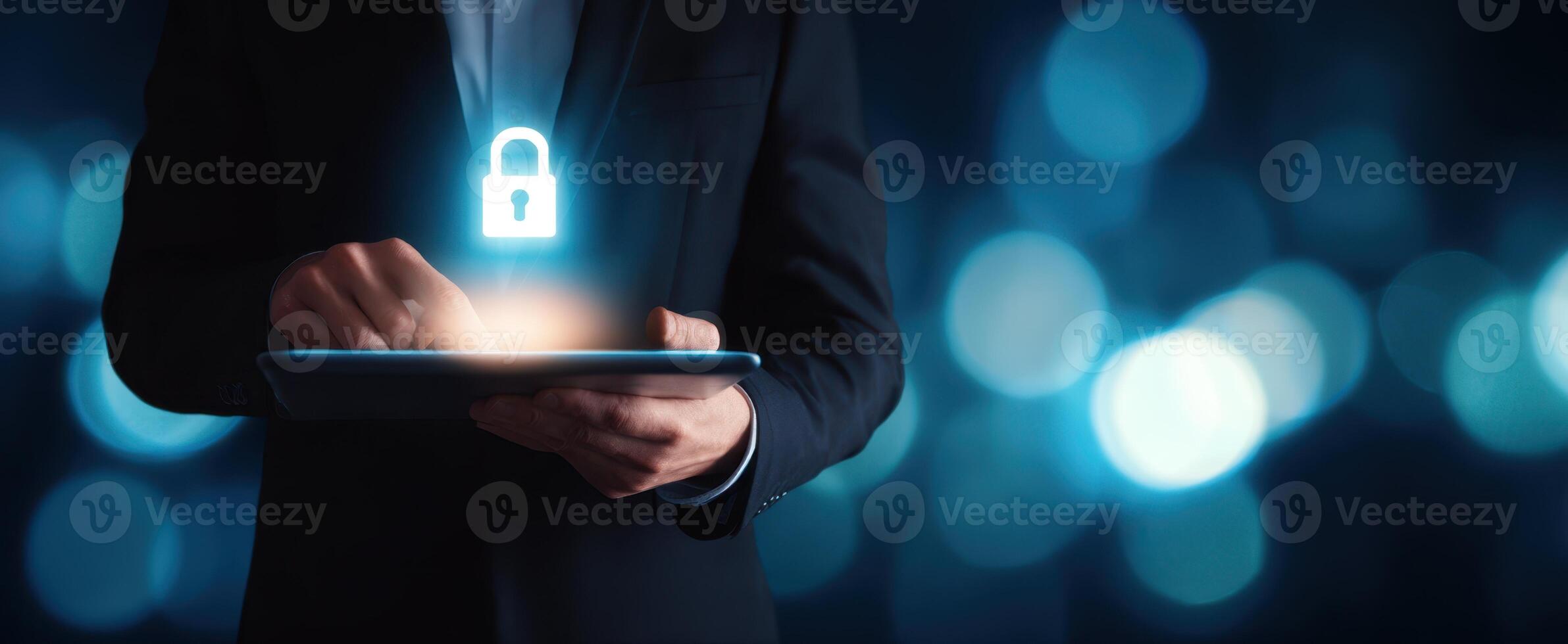 The businessman interacting with a tablet featuring a glowing security lock icon. photo