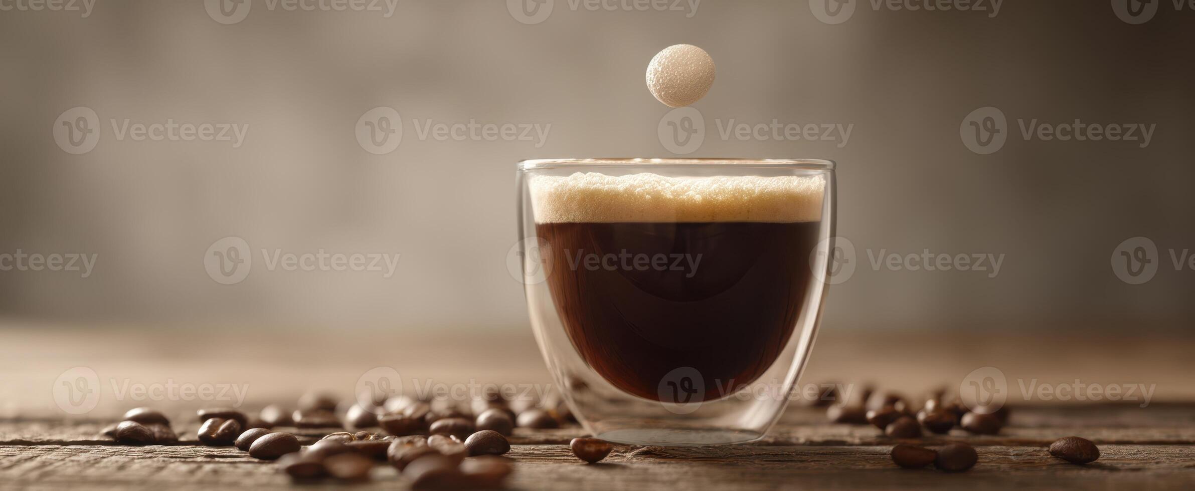 The coffee cup capturing a droplet above its frothy surface. photo