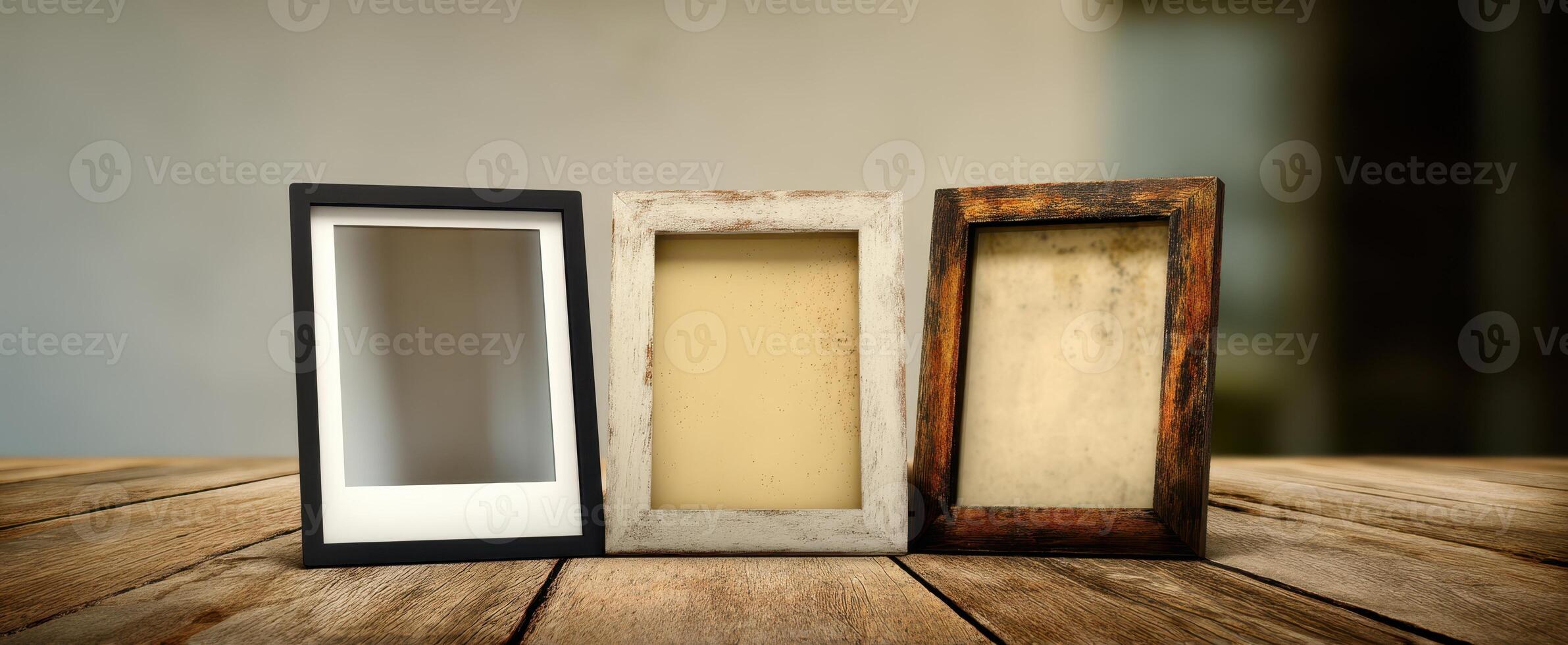 The collection of empty photo frames showcasing various styles on a wooden table.