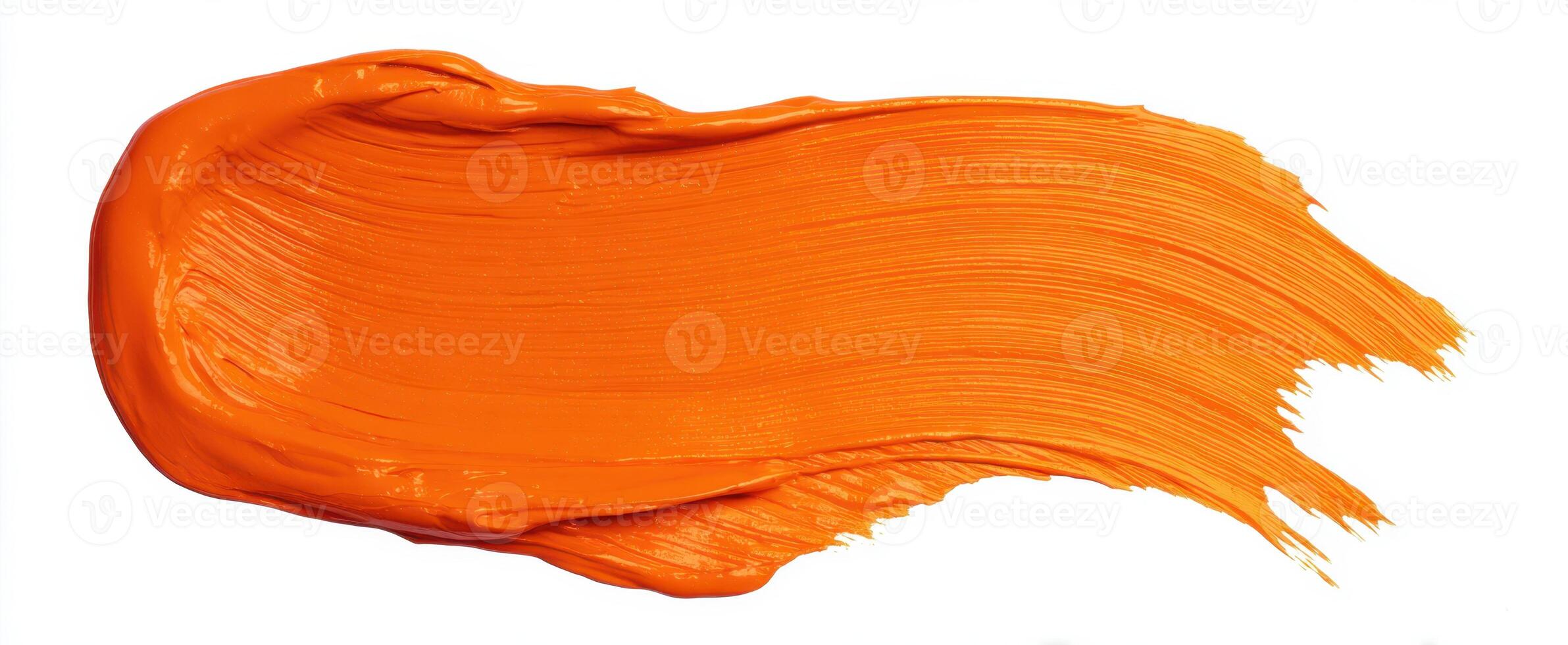 The vibrant orange paint stroke creating a stunning abstract design. photo