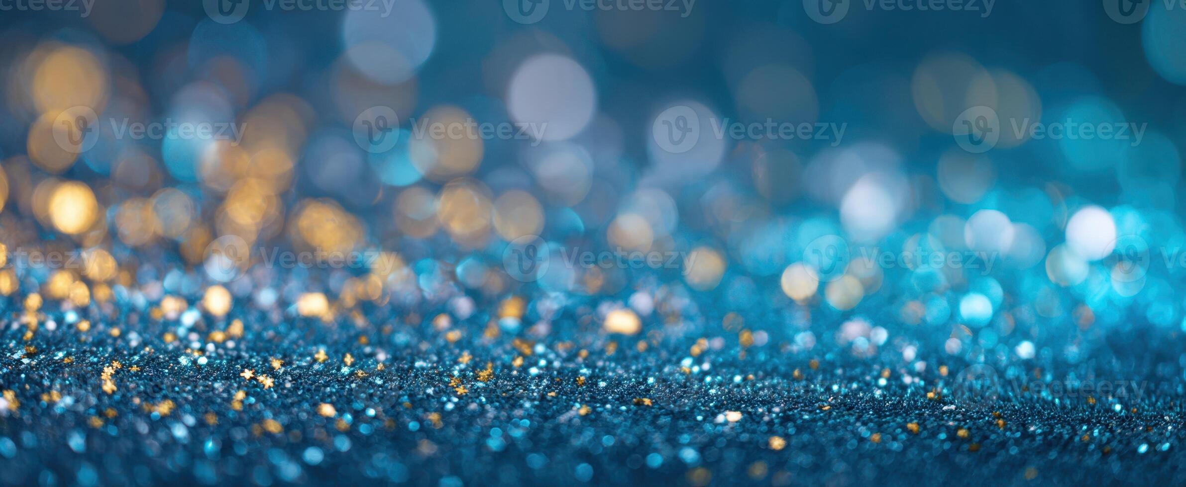 The mesmerizing glittering background with blue and gold sparkles. photo