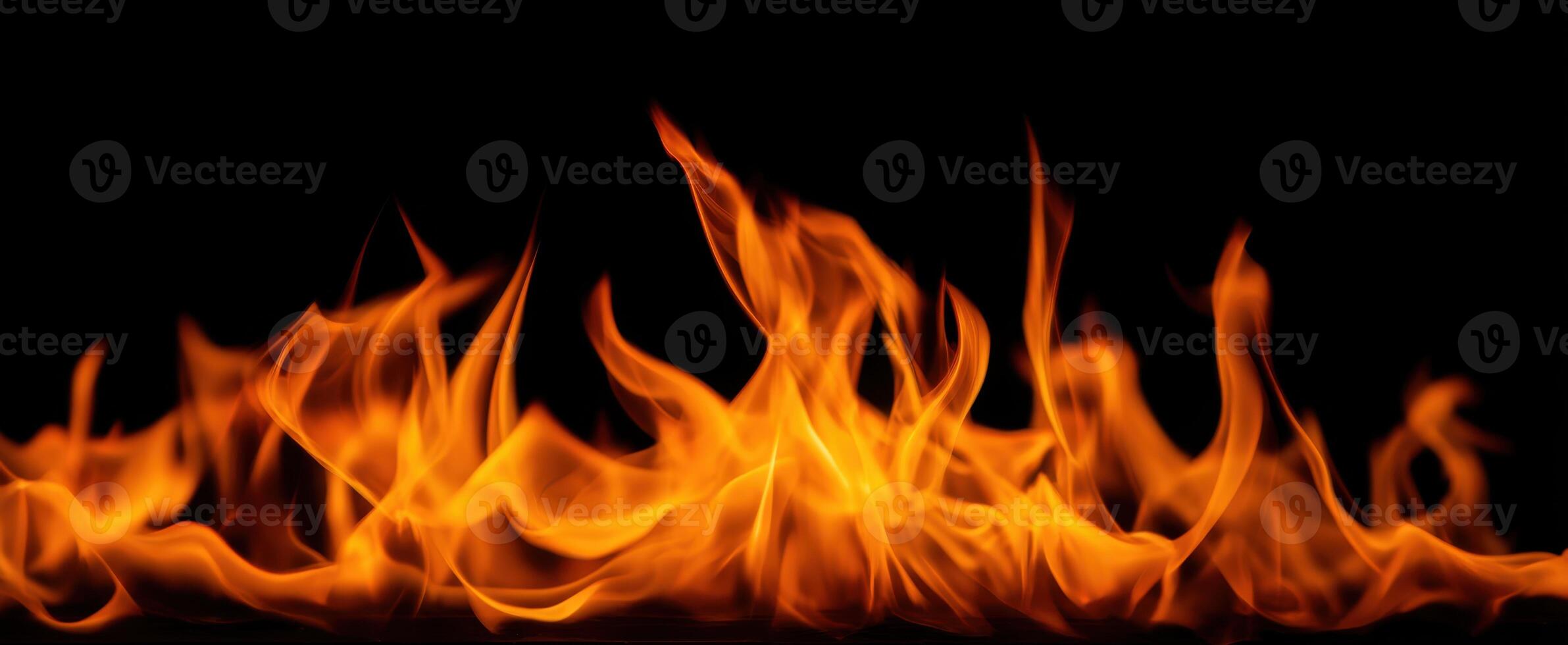 The mesmerizing dance of flames in a captivating dark background photo