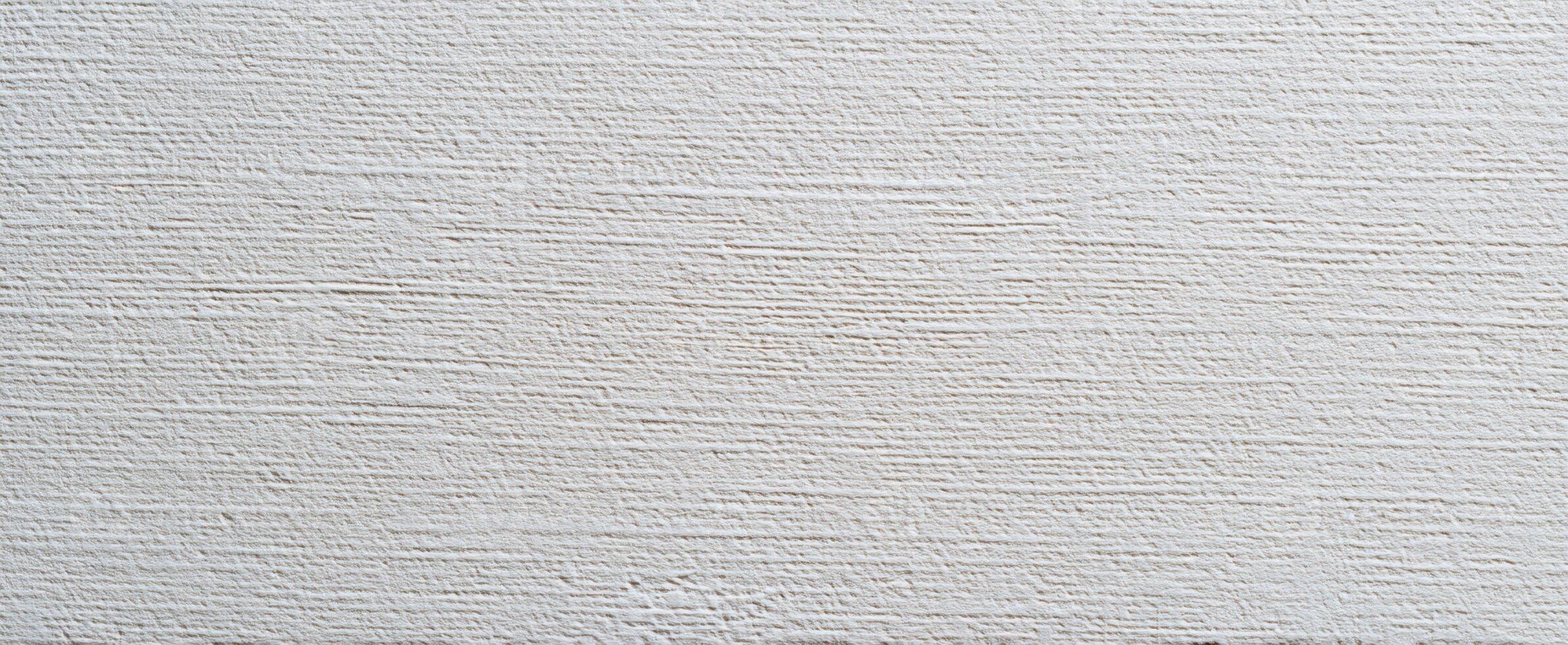 The textured white wall surface ideal for modern design backgrounds. photo