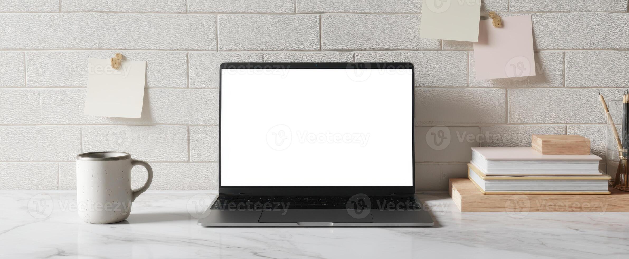 The sleek laptop on a modern desk with minimal workspace aesthetics. photo