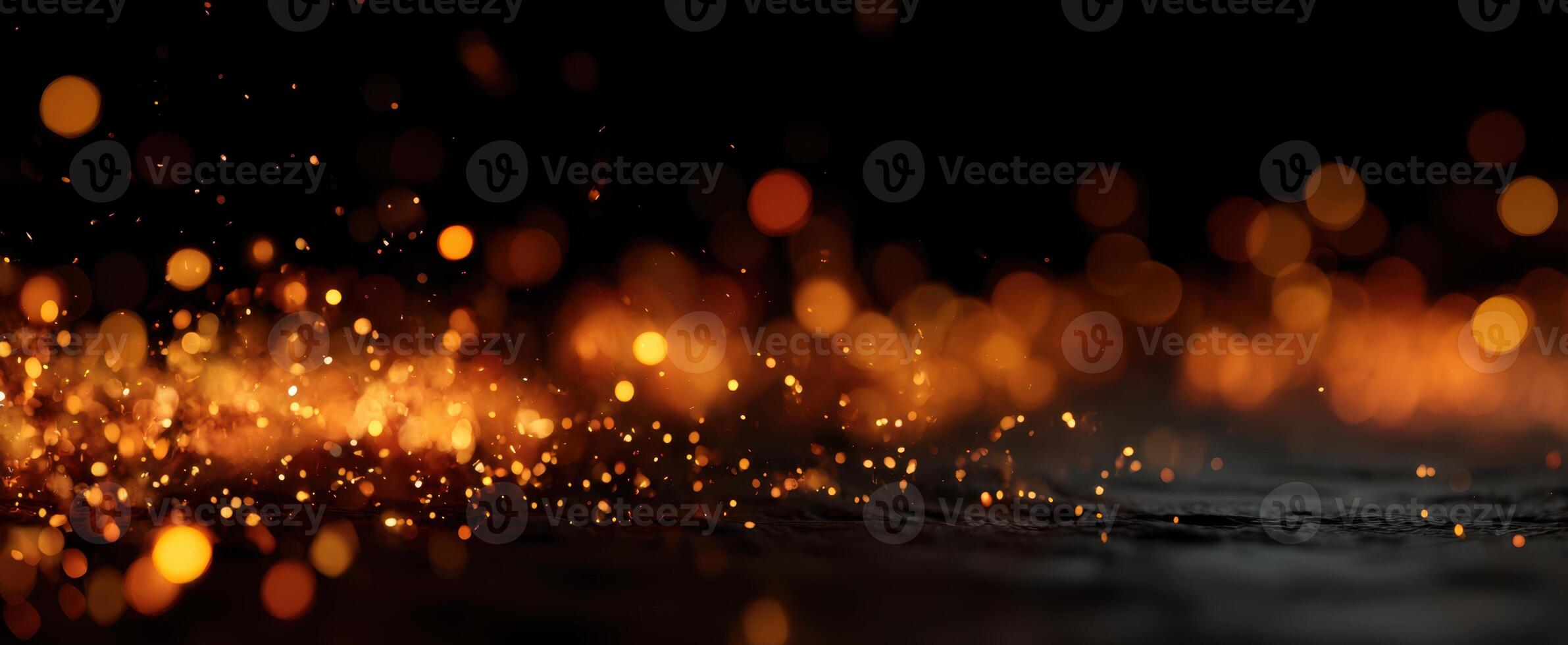 The captivating display of glowing sparks and particles in a dark backdrop. photo