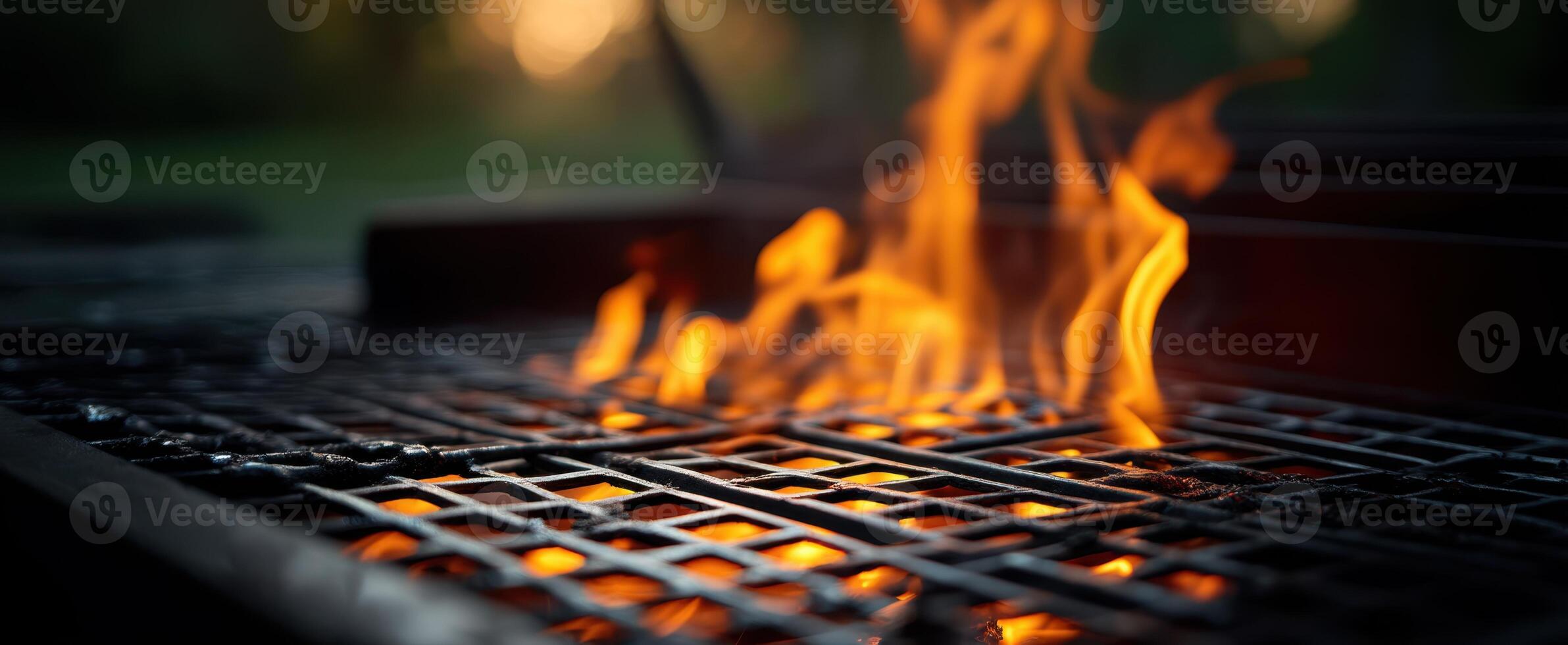 The vibrant flames dancing on a grill during a summer evening gathering. photo