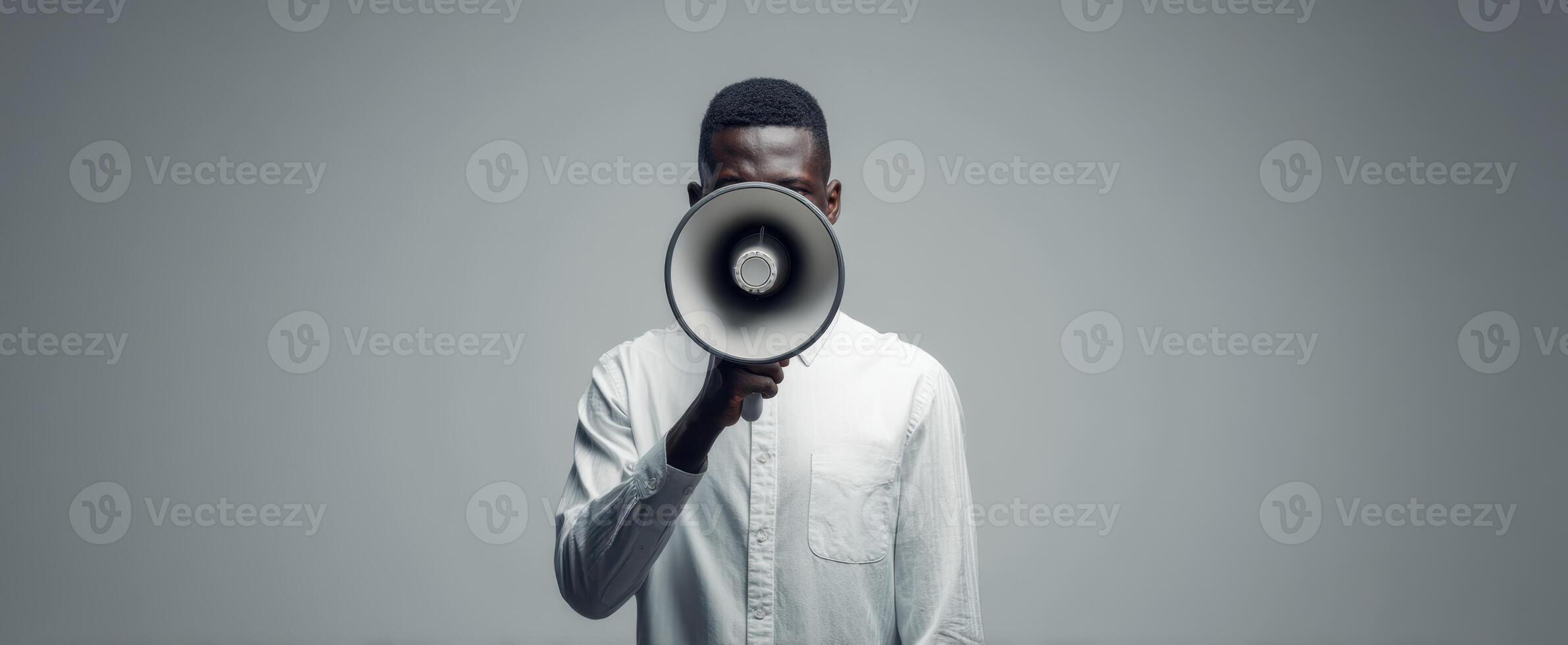 The Man Holding a Megaphone in a Modern Studio Setting photo