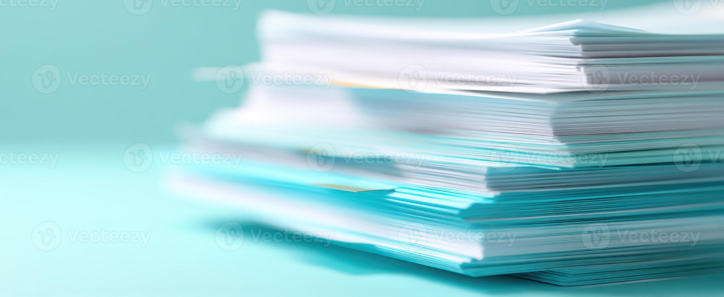 The stack of papers in an organized arrangement on a blue background. photo