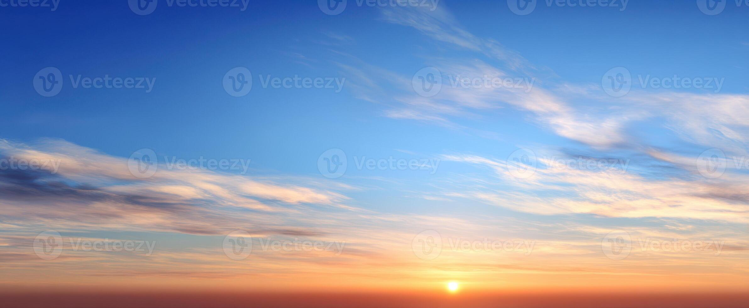 The serene sunset casting vibrant colors across the expansive sky. photo