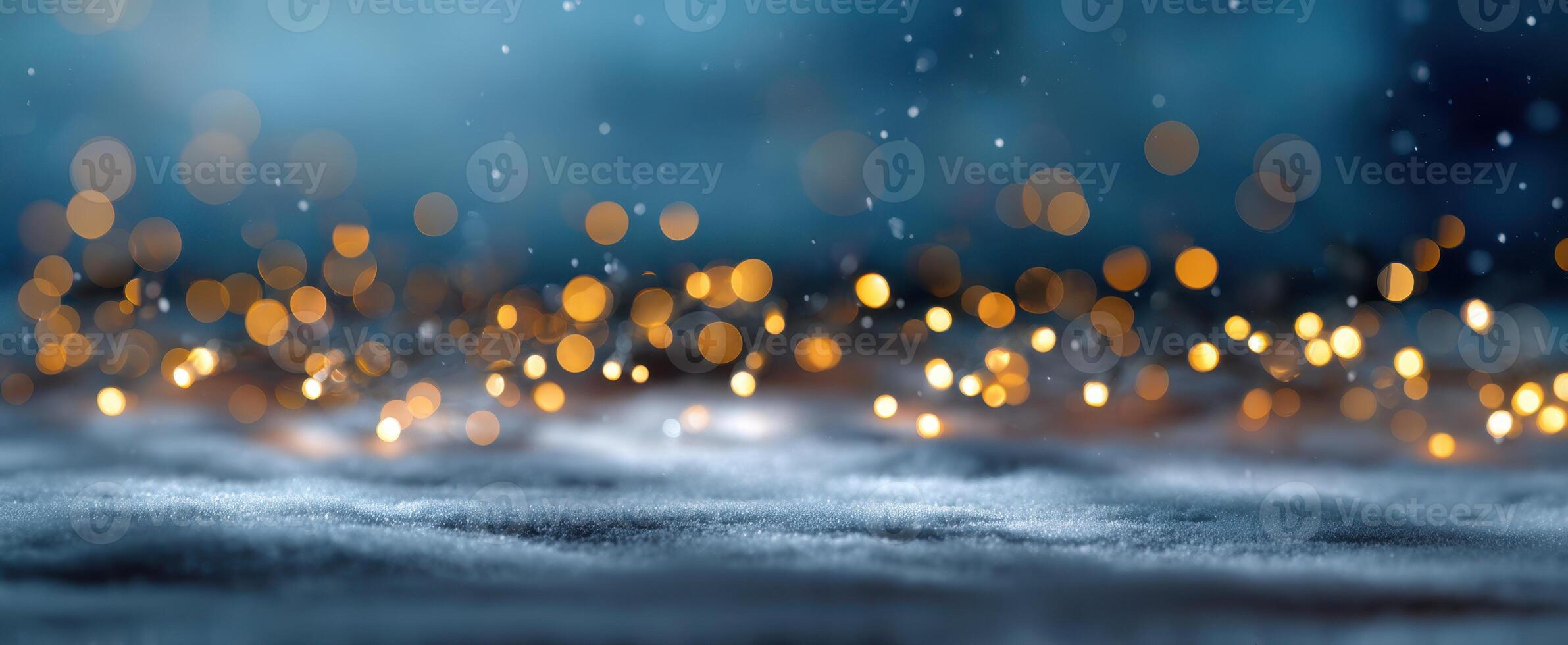 The beautiful bokeh lights glowing softly in a wintery snowy landscape. photo