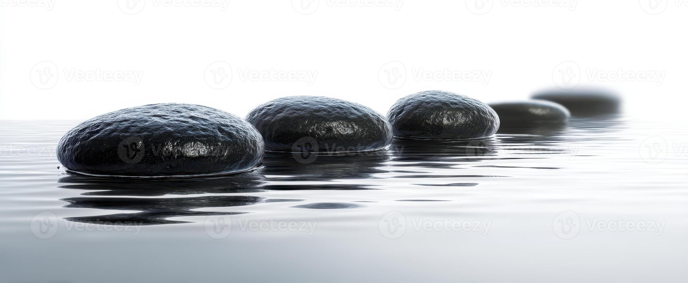 The serene arrangement of smooth stones on a tranquil water surface. photo