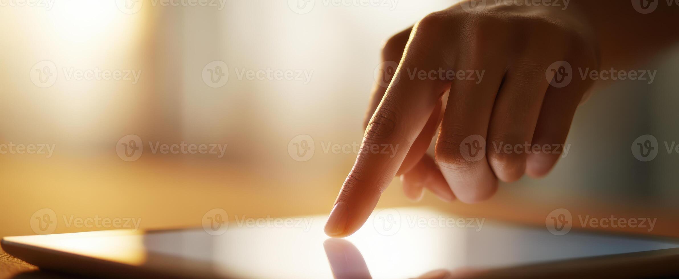 The Close-Up Interaction of a Finger on a Touchscreen Tablet photo