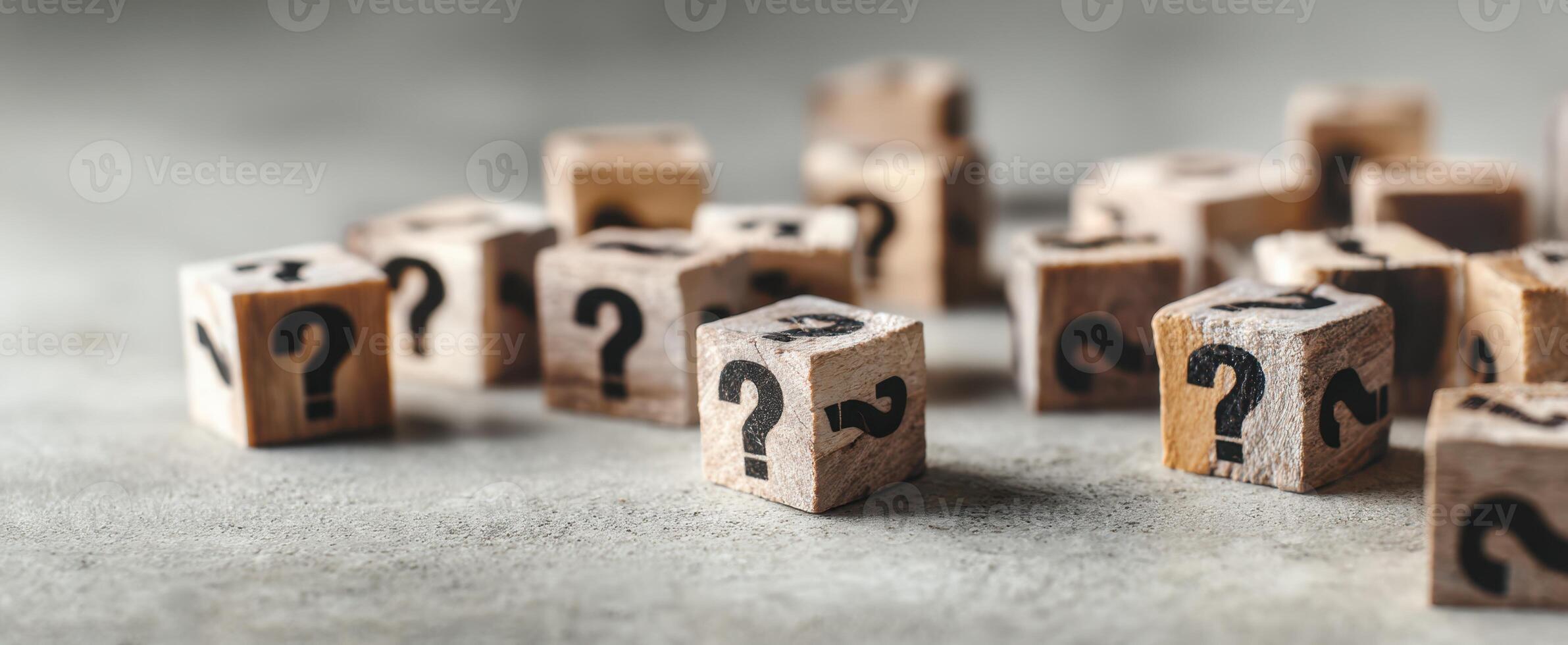The wooden question blocks symbolizing curiosity and exploration of unknown concepts. photo