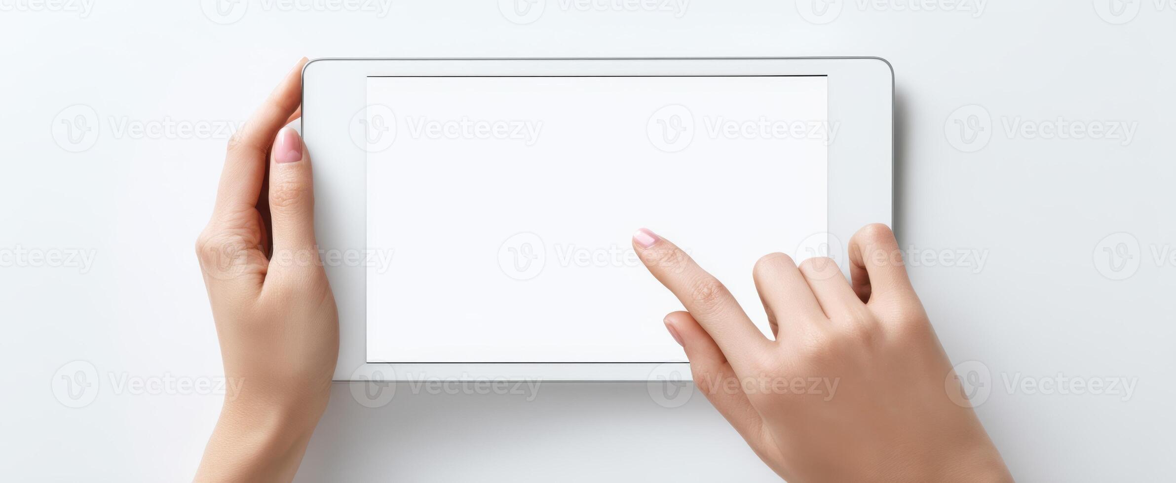 The tablet with a blank screen demonstrating user interaction and digital connectivity. photo