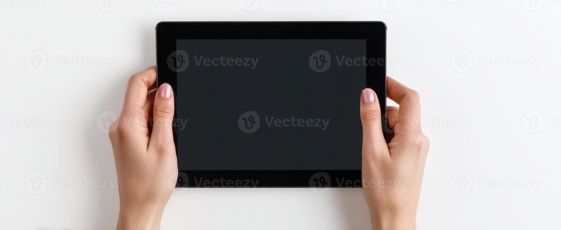 The sleek tablet held in hands ready for digital interaction photo