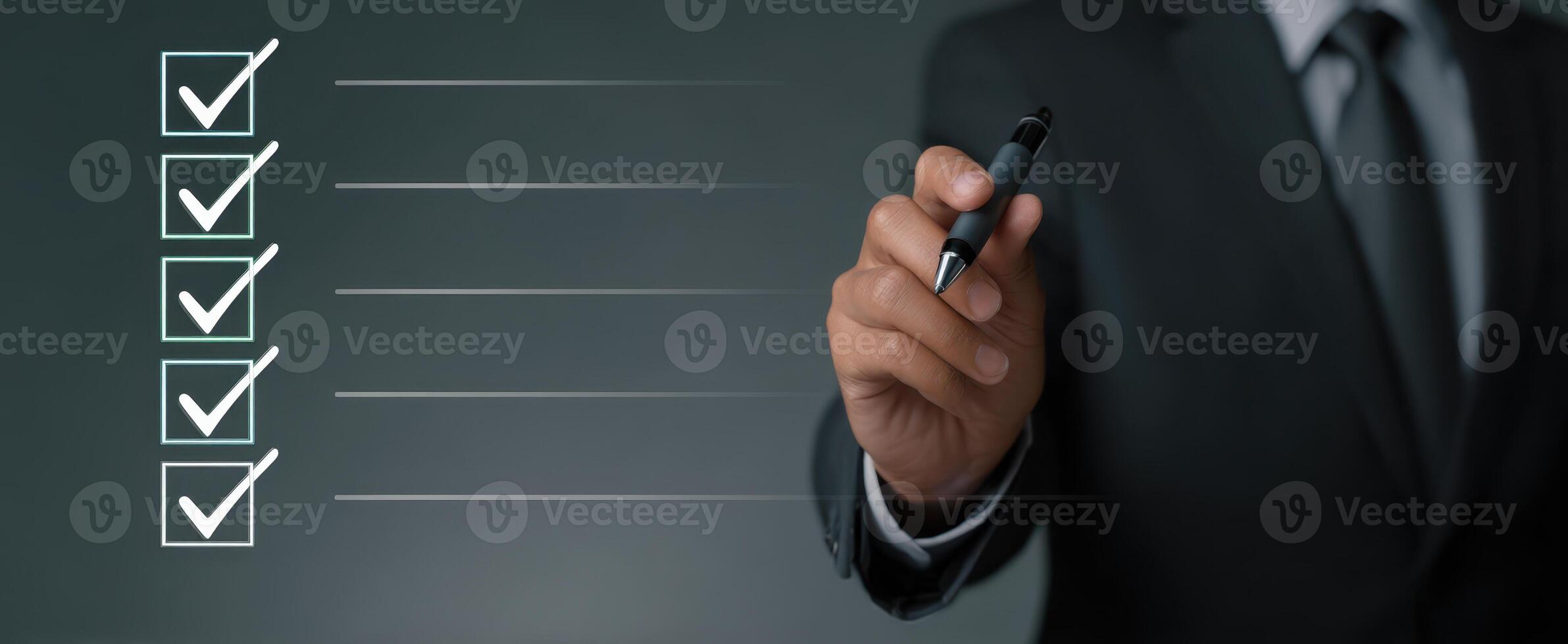 The businessman marking tasks on a checklist for successful completion. photo