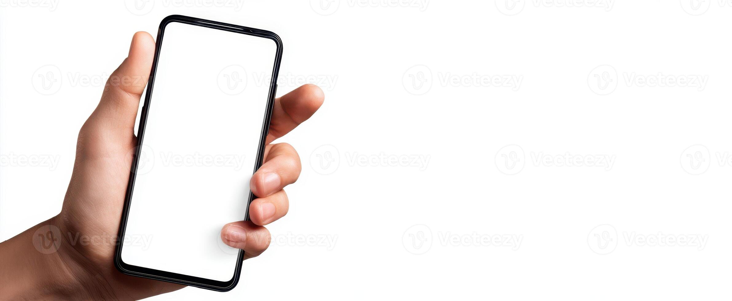 The hand holding a smartphone with a blank screen for your design needs. photo
