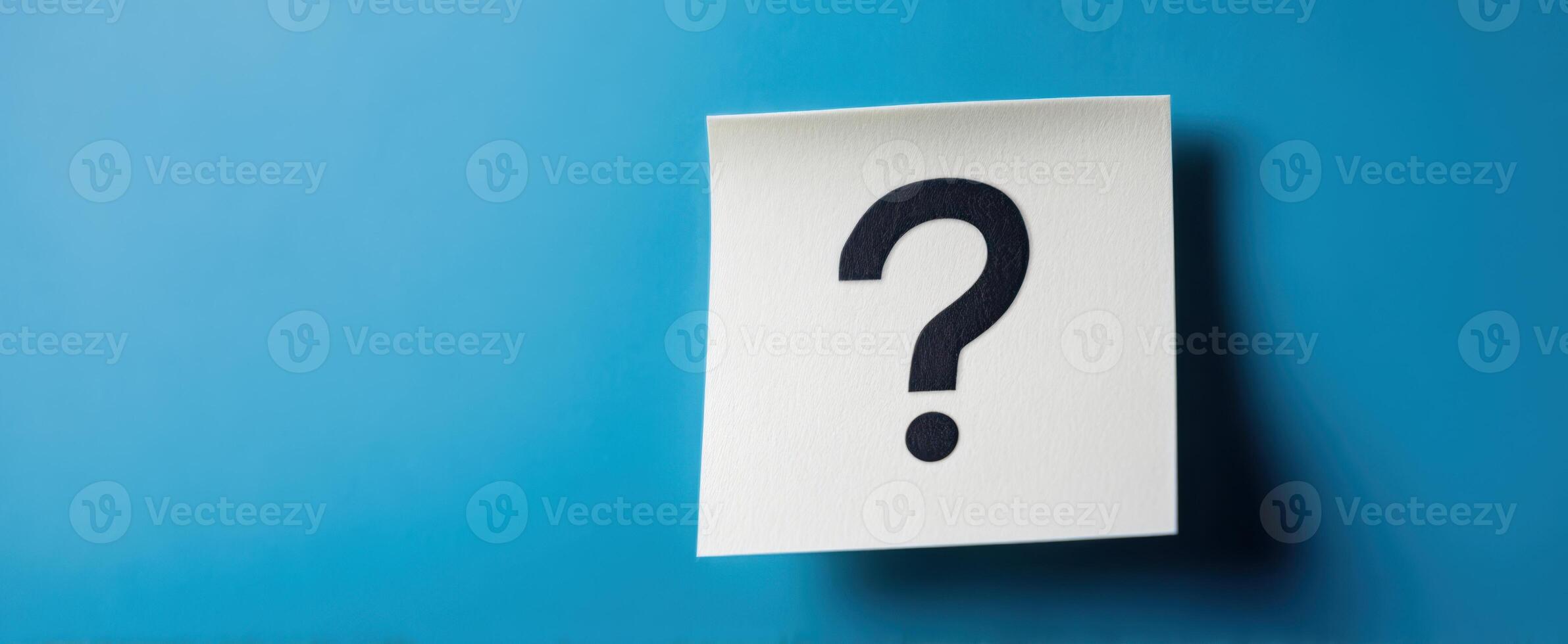 The Blank Note with a Question Mark on a Blue Background photo