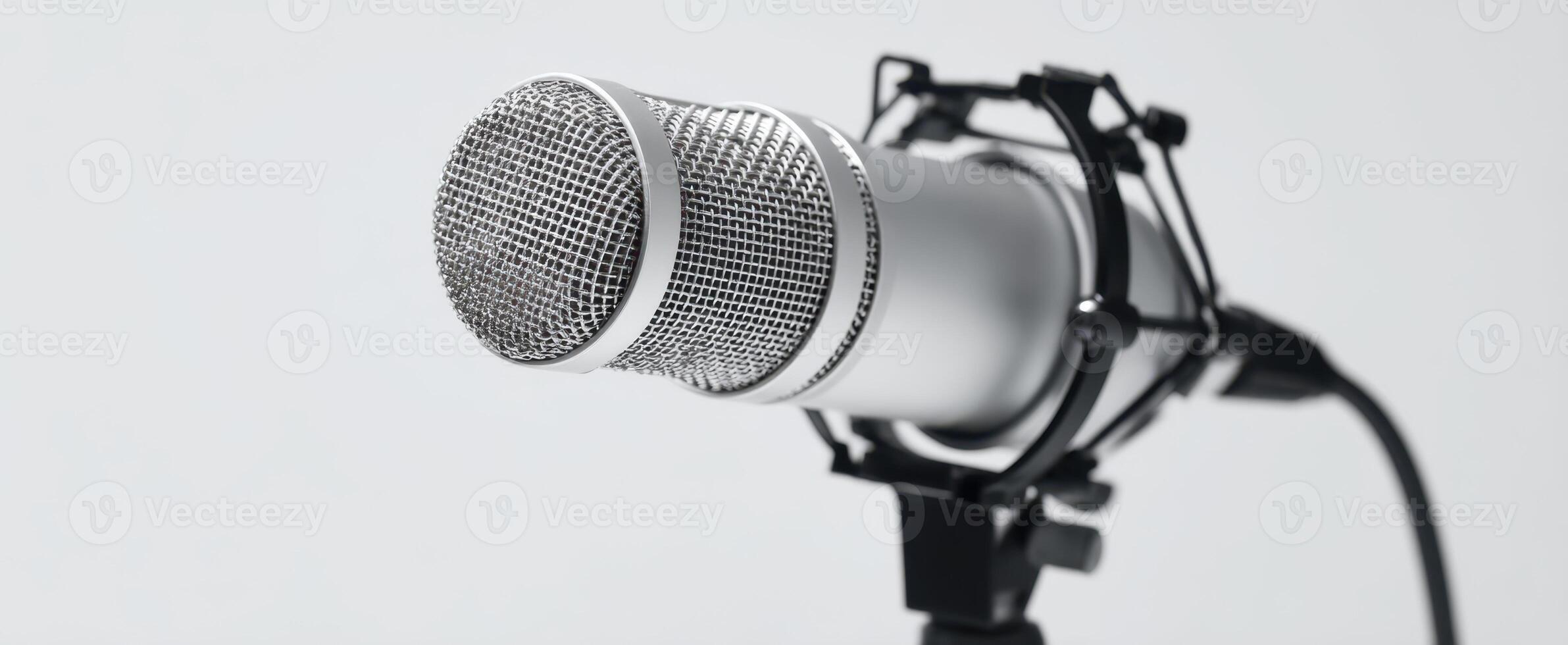 The sleek microphone poised for perfect sound capture in a studio setting. photo