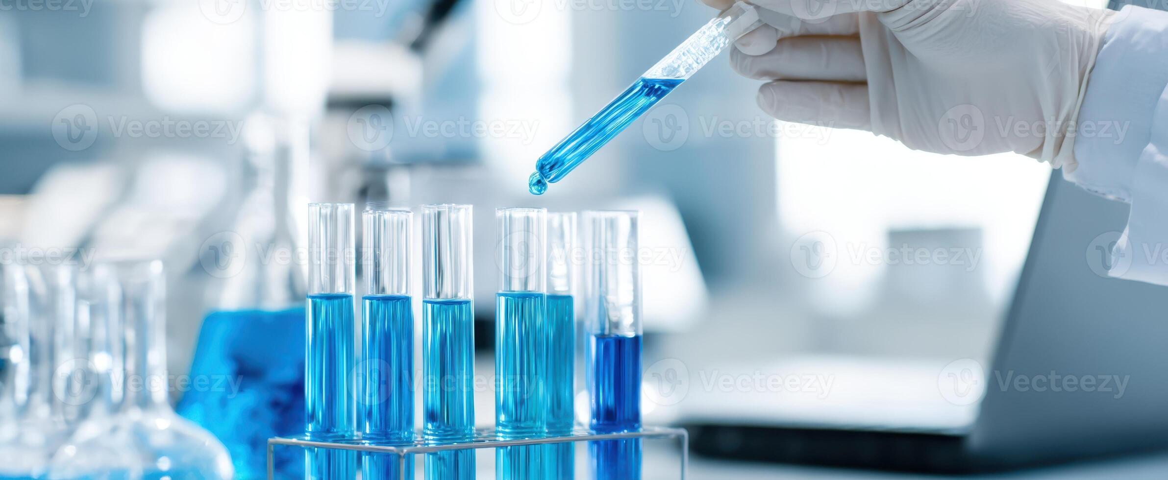 The scientist performing a precise pipetting technique in a laboratory setting. photo