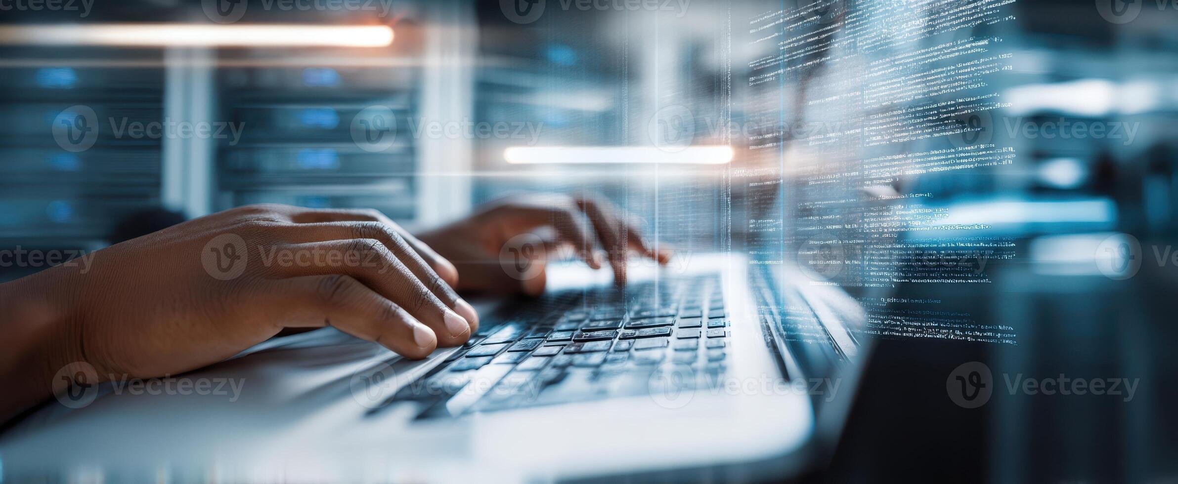 The close-up of hands typing on a laptop in a digital workspace. photo