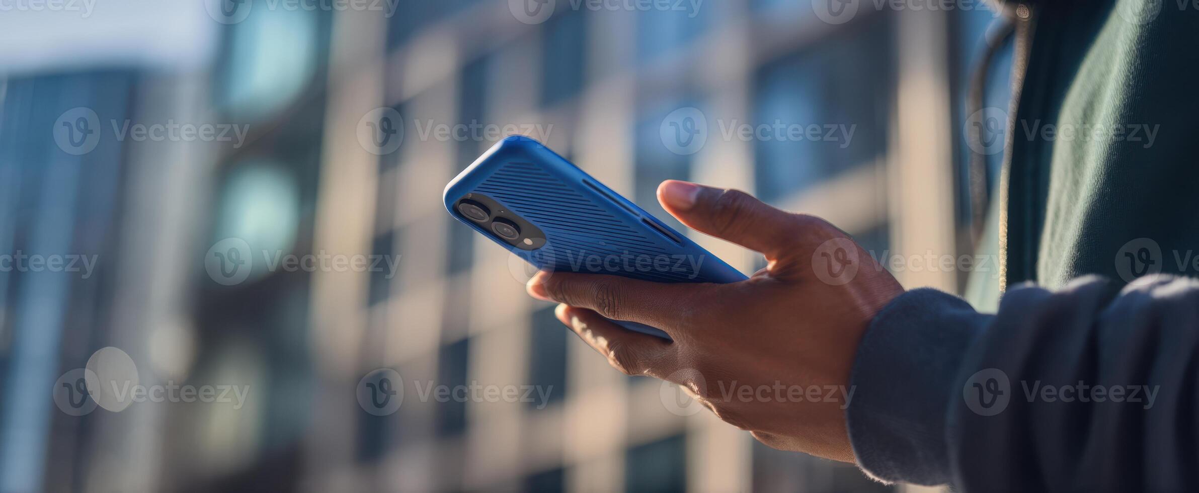 The smartphone in hand against an urban backdrop showcasing modern lifestyle and technology. photo