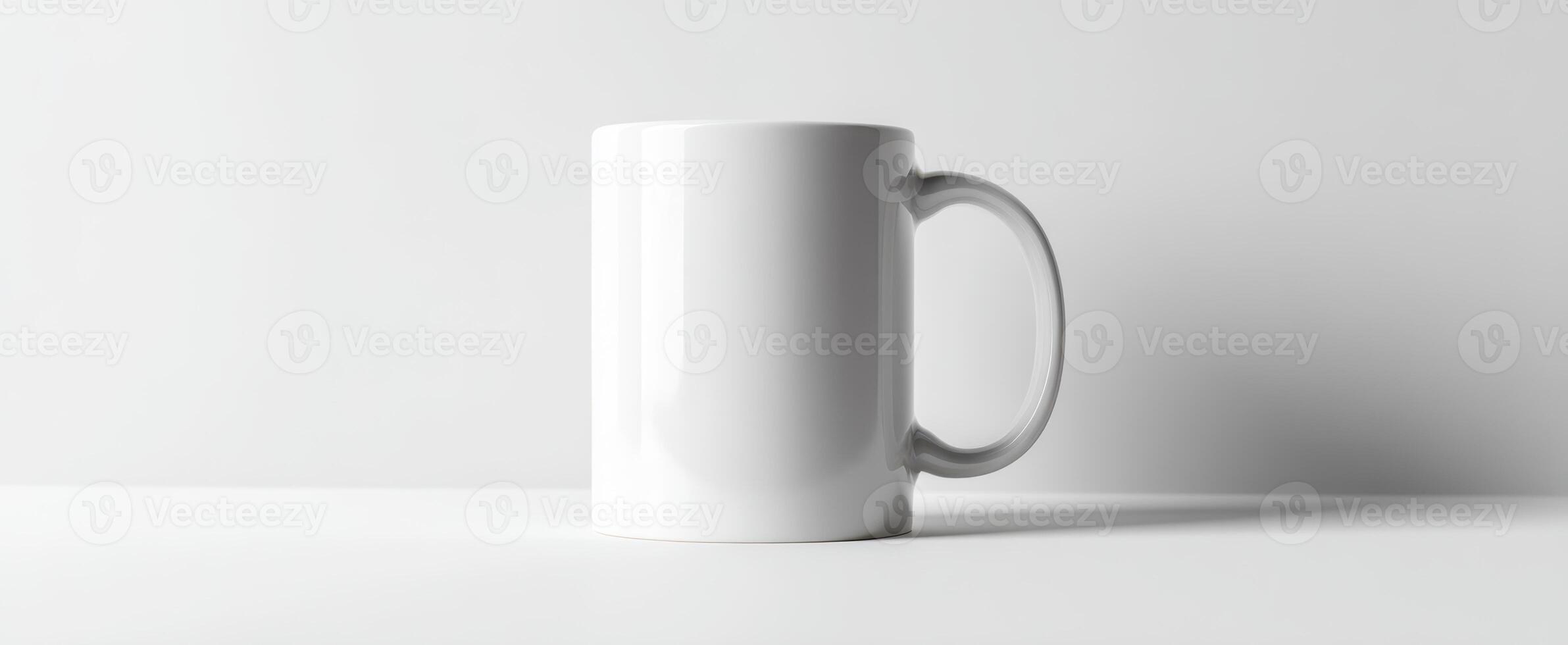 The simple white mug displayed on a clean modern table surface photo