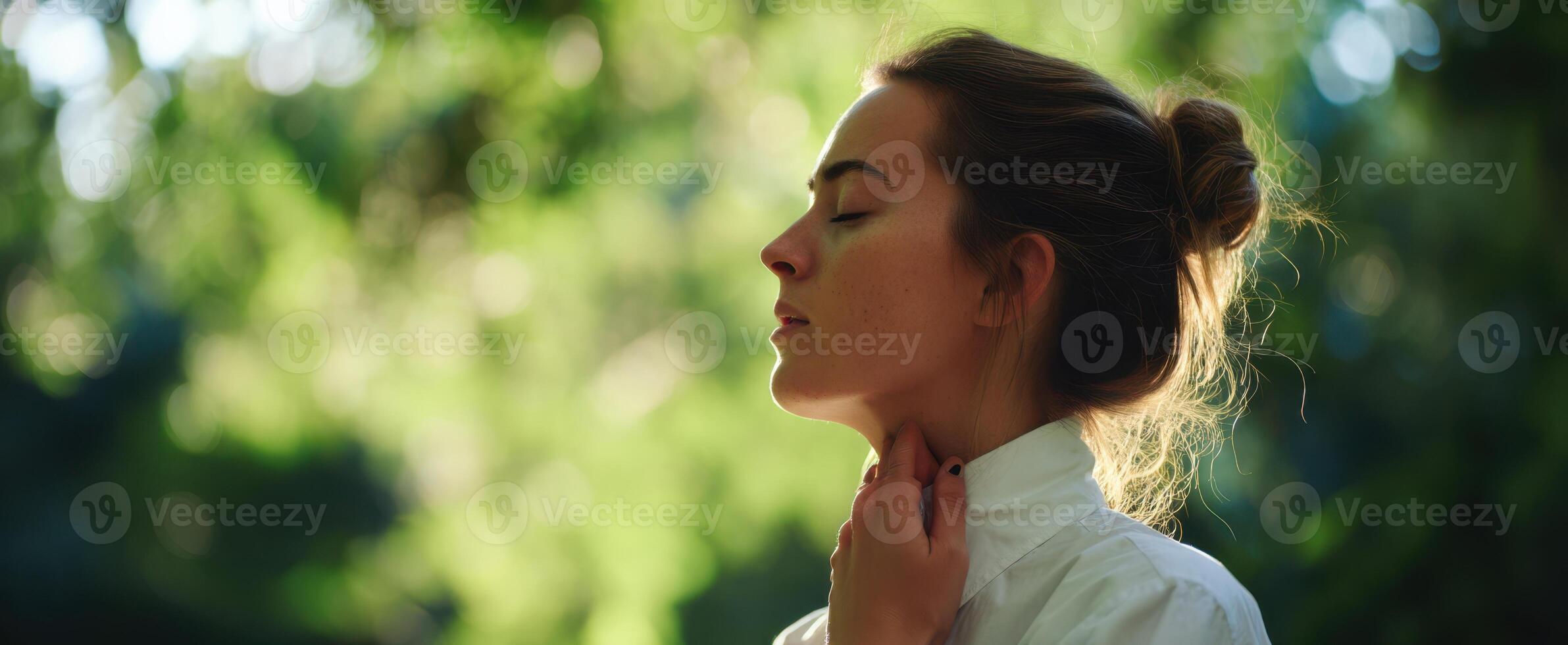 The serene woman enjoying tranquility in a lush green environment. photo