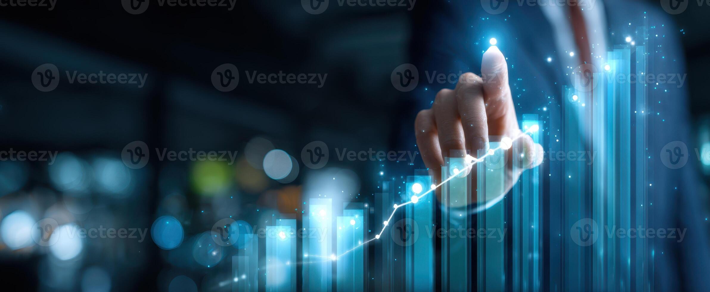 The hand directing a rising graph in a digital business environment. photo