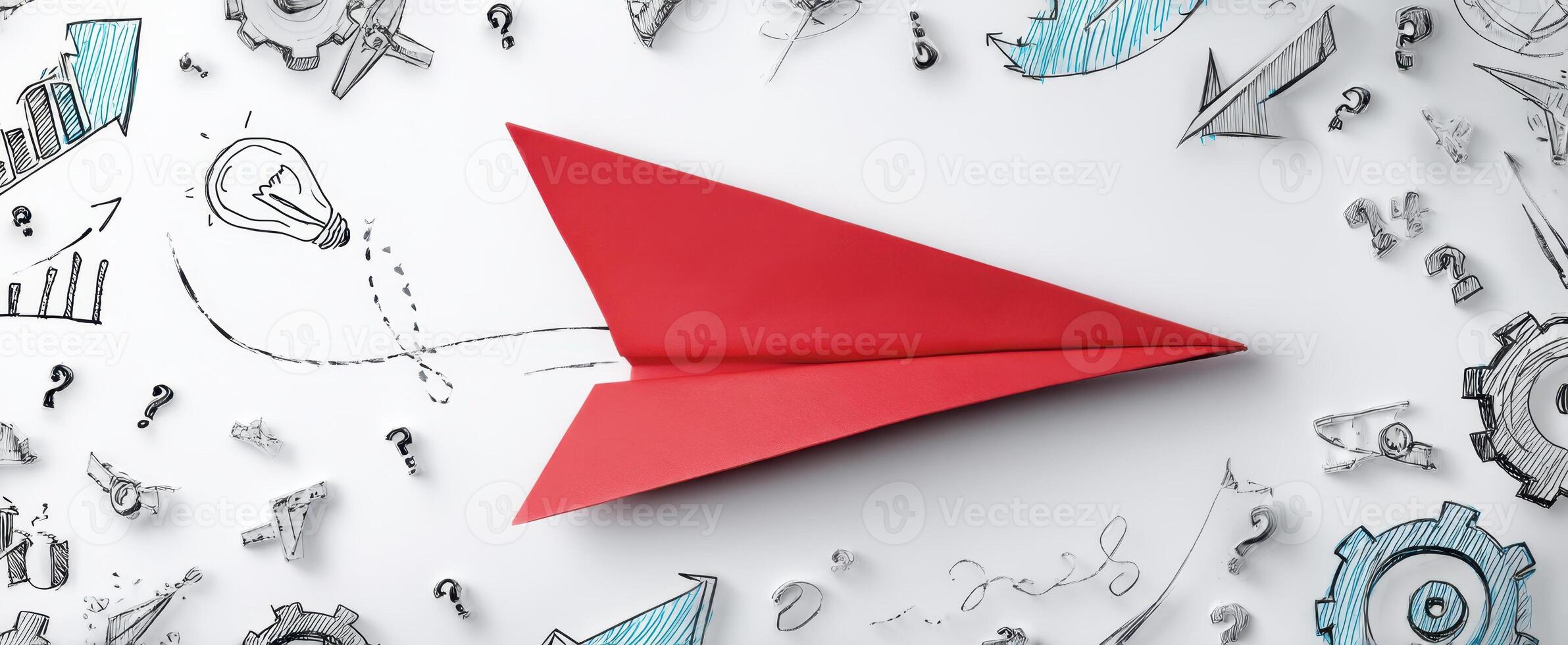 The red paper airplane soaring among innovative business sketches and ideas. photo