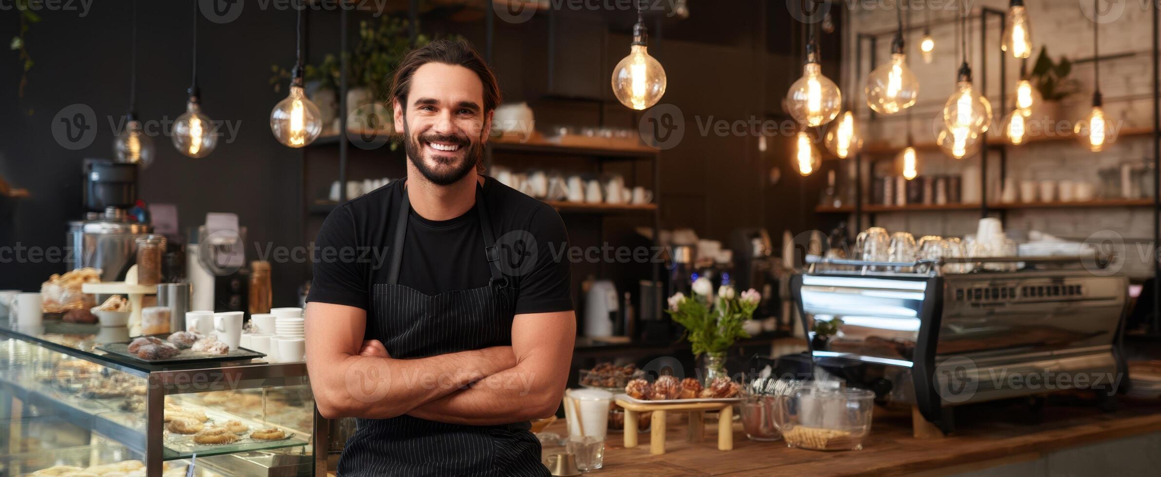 A smiling man standing in front of a coffee shop photo