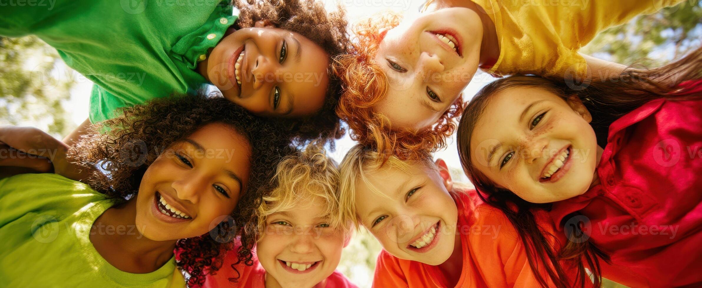 The joyful group of children sharing laughter and friendship in a sunny setting. photo