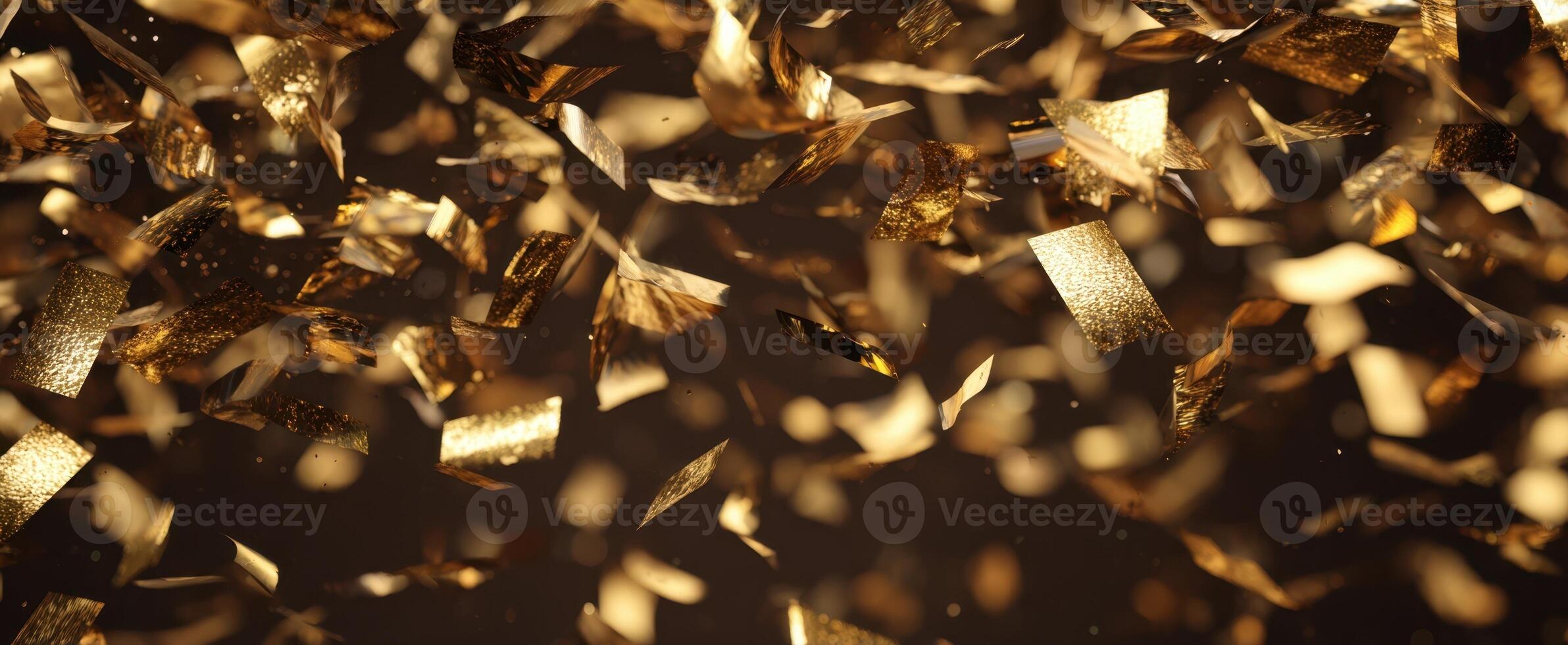 The shimmering gold confetti creating a festive atmosphere for celebrations. photo