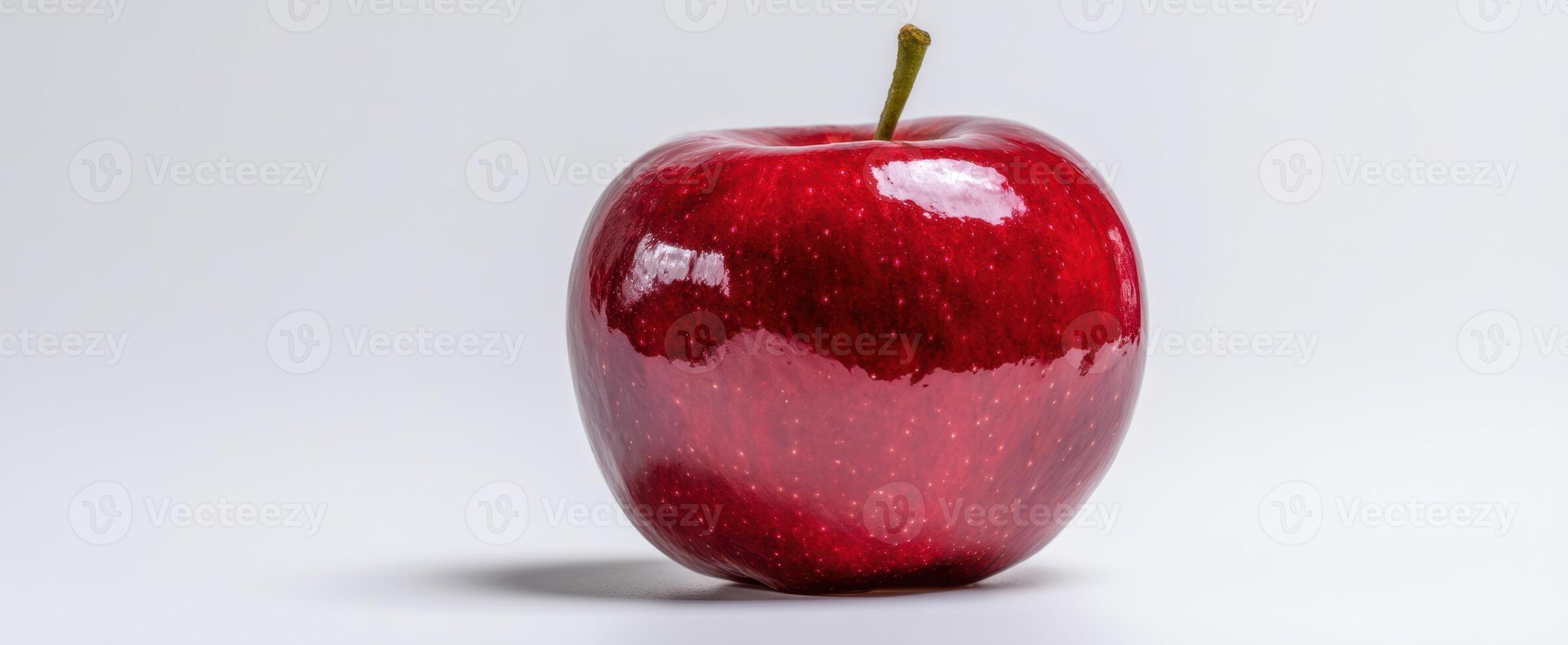 The vibrant red apple showcasing its glossy surface and natural beauty. photo