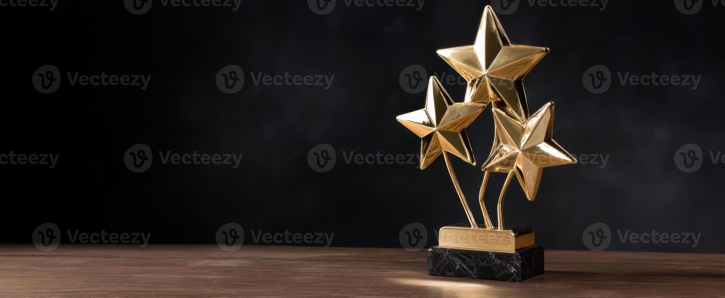 The elegant trophy featuring three golden stars on a dark background. photo