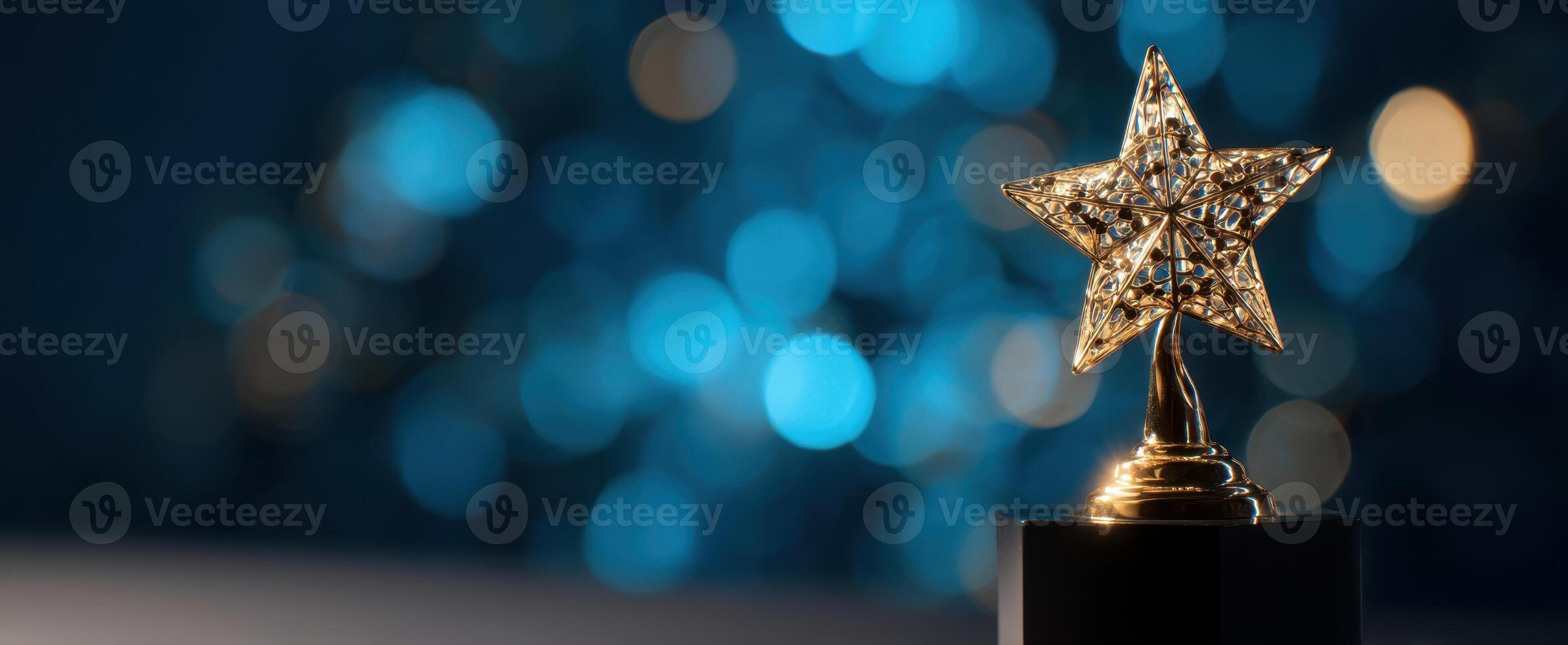 The gleaming star trophy shining against a dreamy bokeh background photo