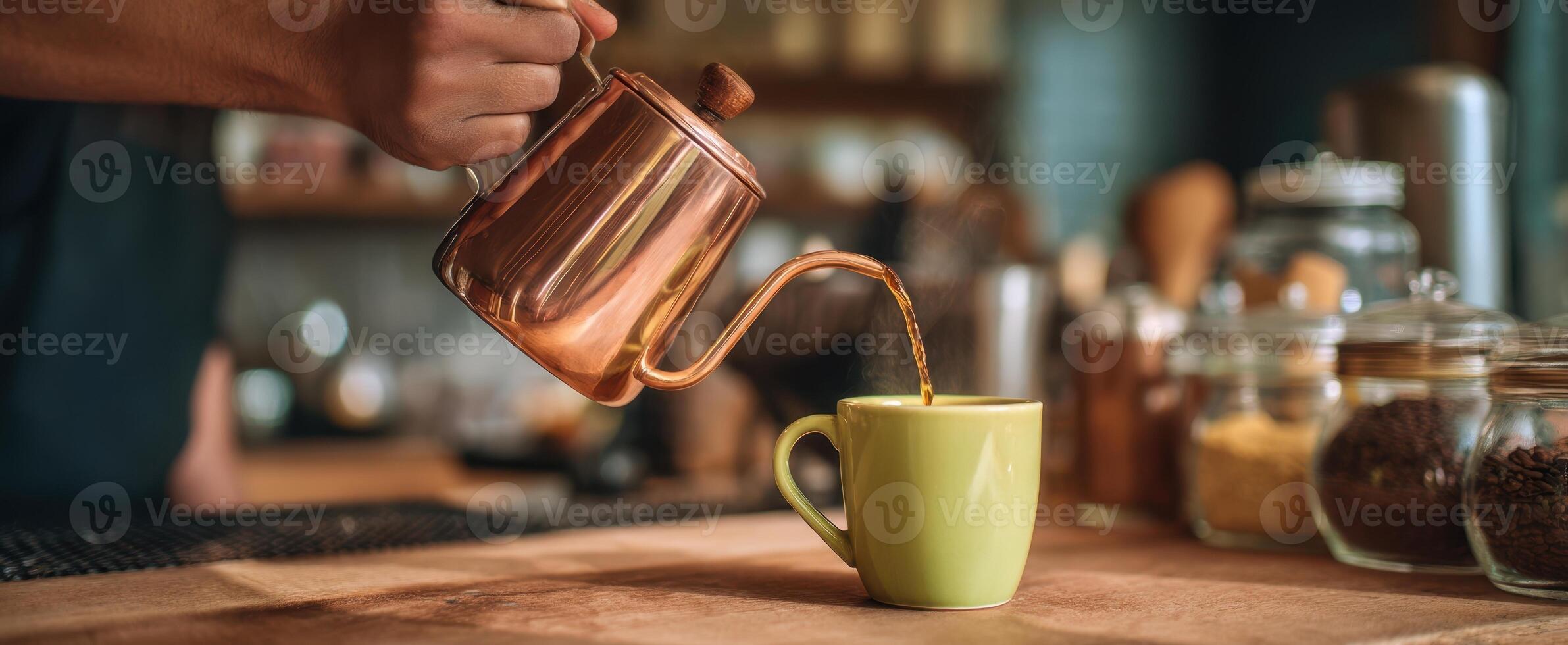 A person pours coffee into a cup photo